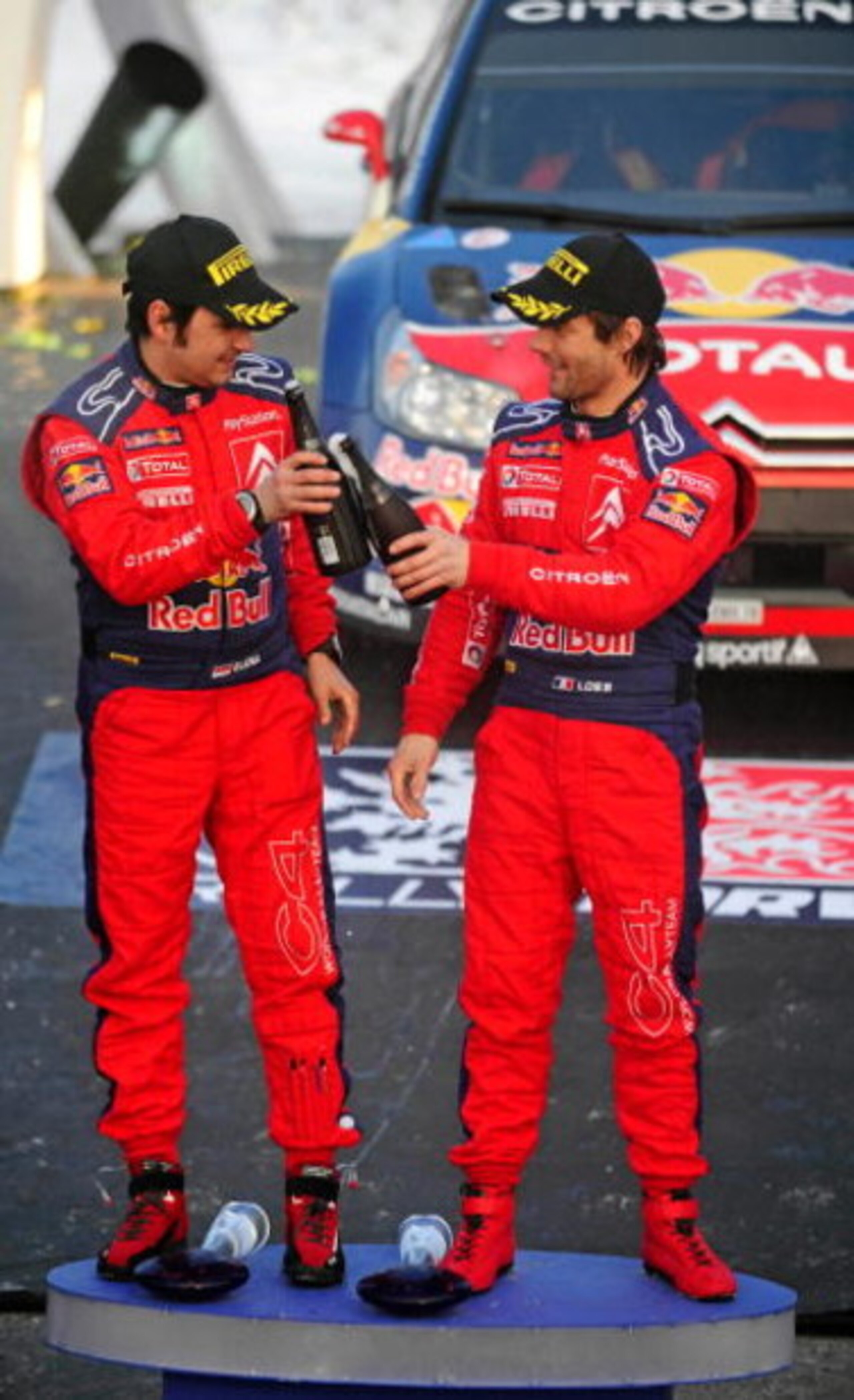 HAMAR, NORWAY - FEBRUARY 15:  Sebastien Loeb (R) of France and Daniel Elena of Monaco, celebrate after overall victory in Rally Norway 2009 on February 15, 2009 in Hamar, Norway.  (Photo by Reporter Images/Getty Images)