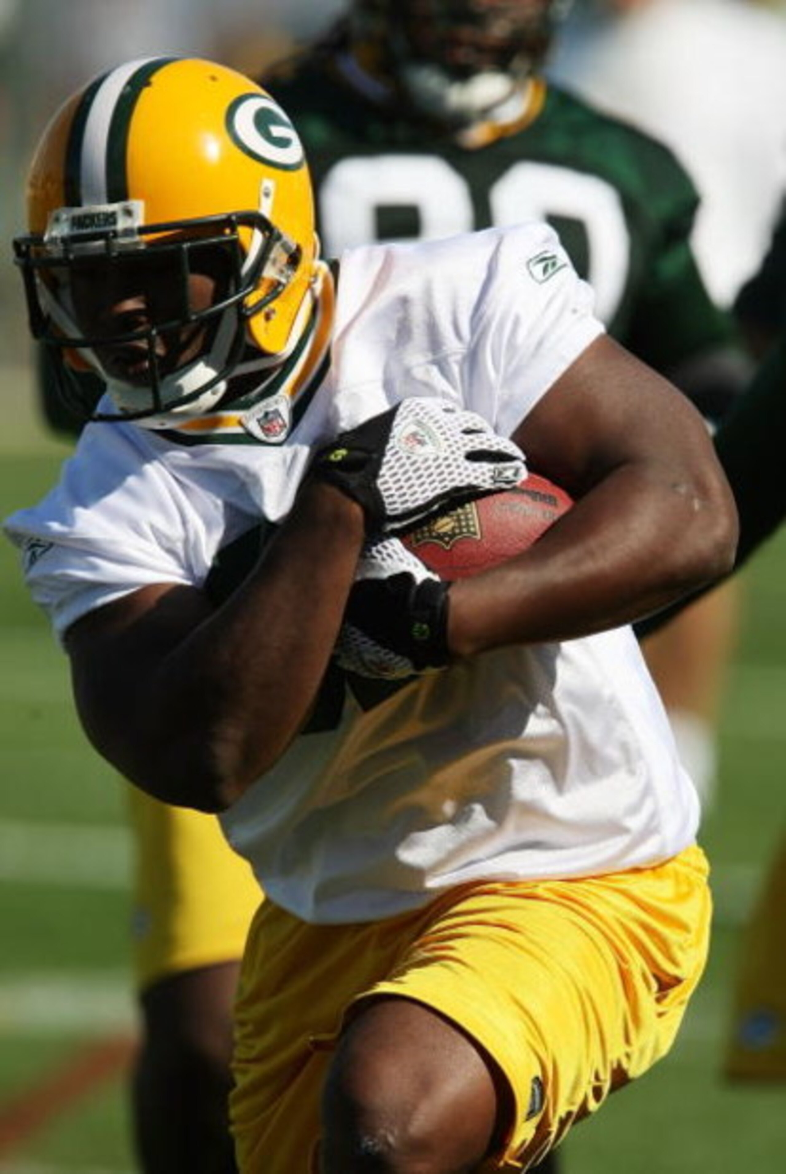 GREEN BAY, WI - JULY 28: Brandon Jackson #32 of the Green Bay Packers runs with the ball during summer training camp on July 28, 2008 at the Hutson Center in Green Bay, Wisconsin. (Photo by Jonathan Daniel/Getty Images)