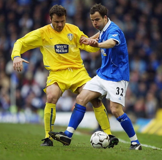 BIRMINGHAM, ENGLAND - MARCH 27:  Mark Viduka of Leeds United tackles Stephen Clemence of Birmingham City during the FA Barclaycard Premiership match between Birmingham City and Leeds United at St. Andrew's on March 27, 2004 in Birmingham, England.  (Photo