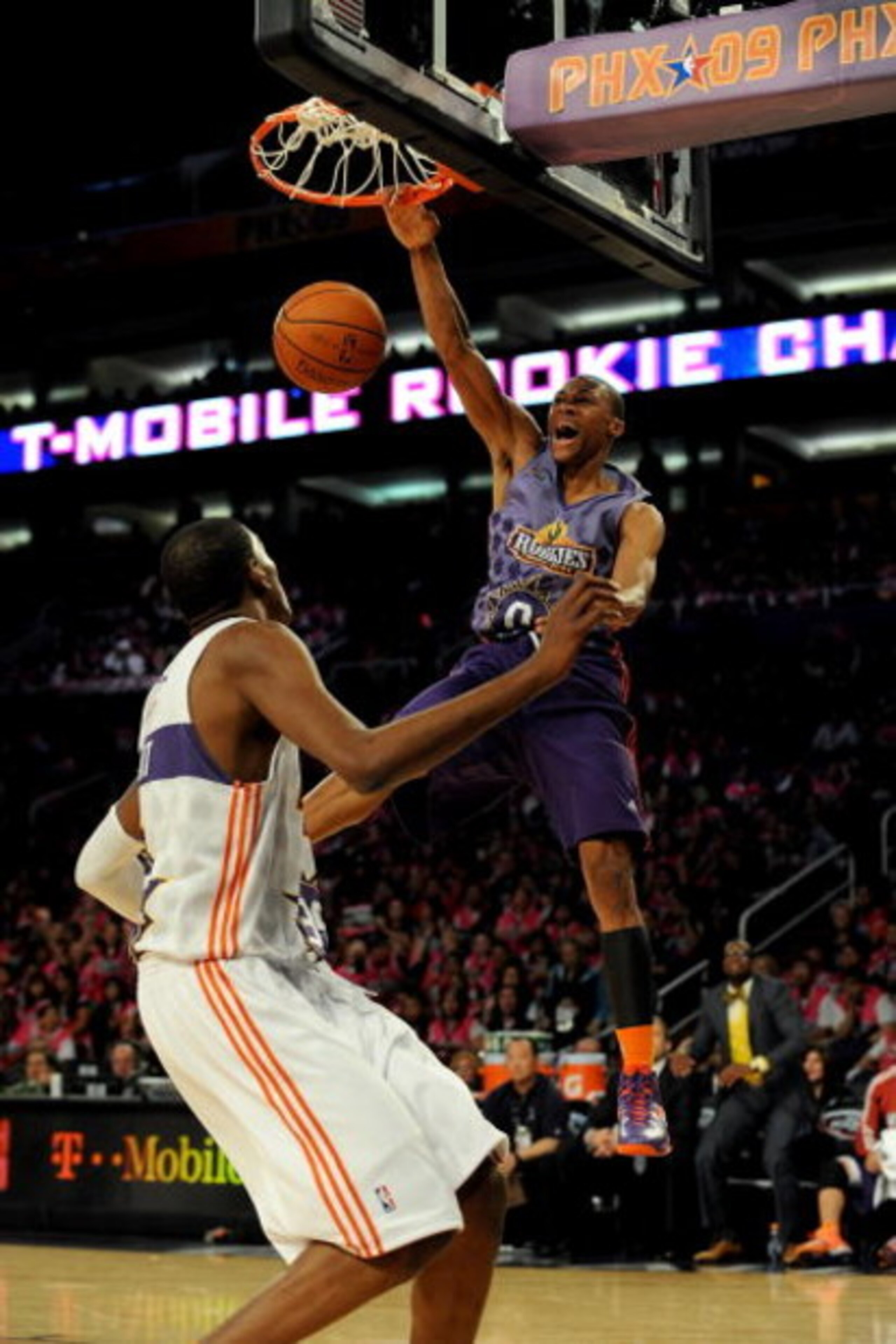 PHOENIX - FEBRUARY 13:  Russell Westbrook #0 of the Rookie team slam dunks over Kevin Durant #35 of the Sophomore team during the T-Mobile Rookie Challenge & Youth Jam part of 2009 NBA All-Star Weekend at US Airways Center on February 13, 2009 in Phoenix,