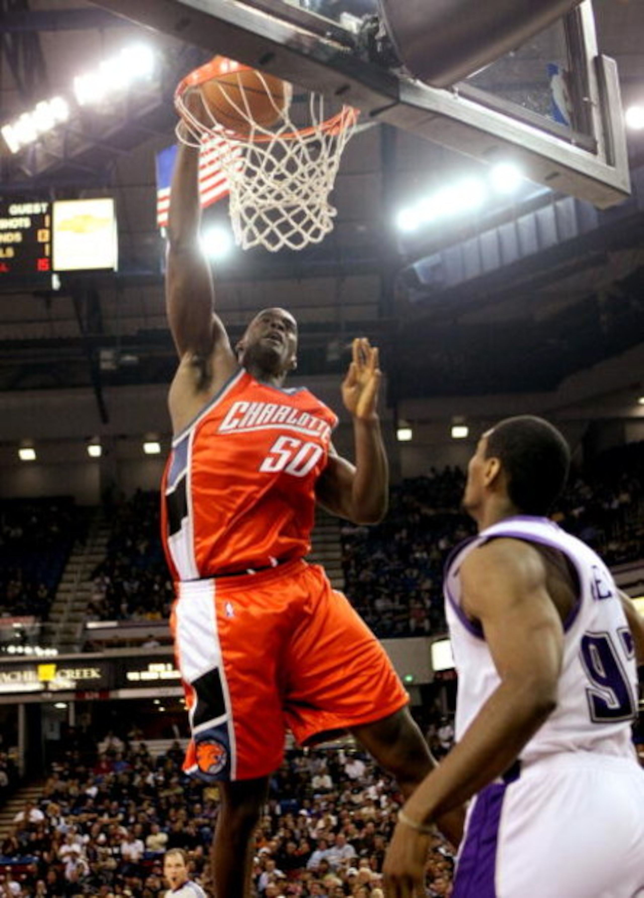 SACRAMENTO, CA - JANUARY 30: Emeka Okafor #50 of the Charlotte Bobcats shoots over Ron Artest #93 of the Sacramento Kings during an NBA game on January 30, 2008 at ARCO Arena in Sacramento, California. NOTE TO USER: User expressly acknowledges and agrees 