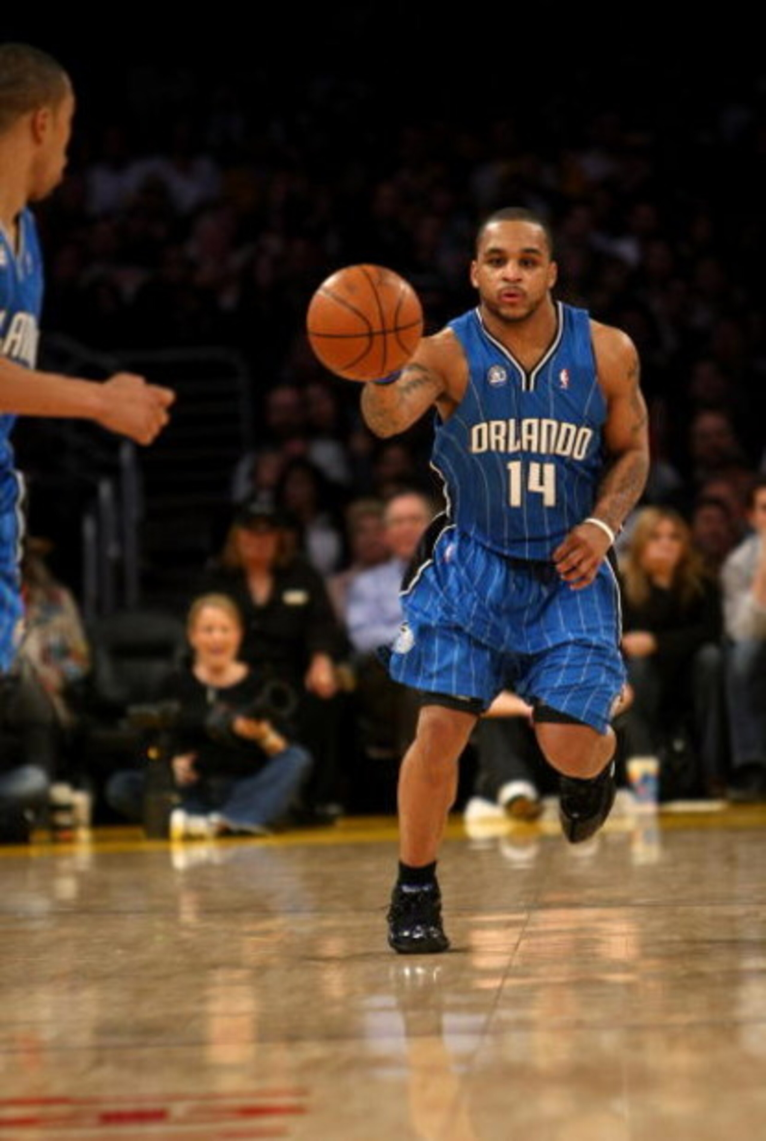 LOS ANGELES, CA - JANUARY 16:  Jameer Nelson #14 of the Orlando Magic throws a pass against the Los Angeles Lakers on January 16, 2009 at Staples Center in Los Angeles, California. The Magic won 109-103.   NOTE TO USER: User expressly acknowledges and agr