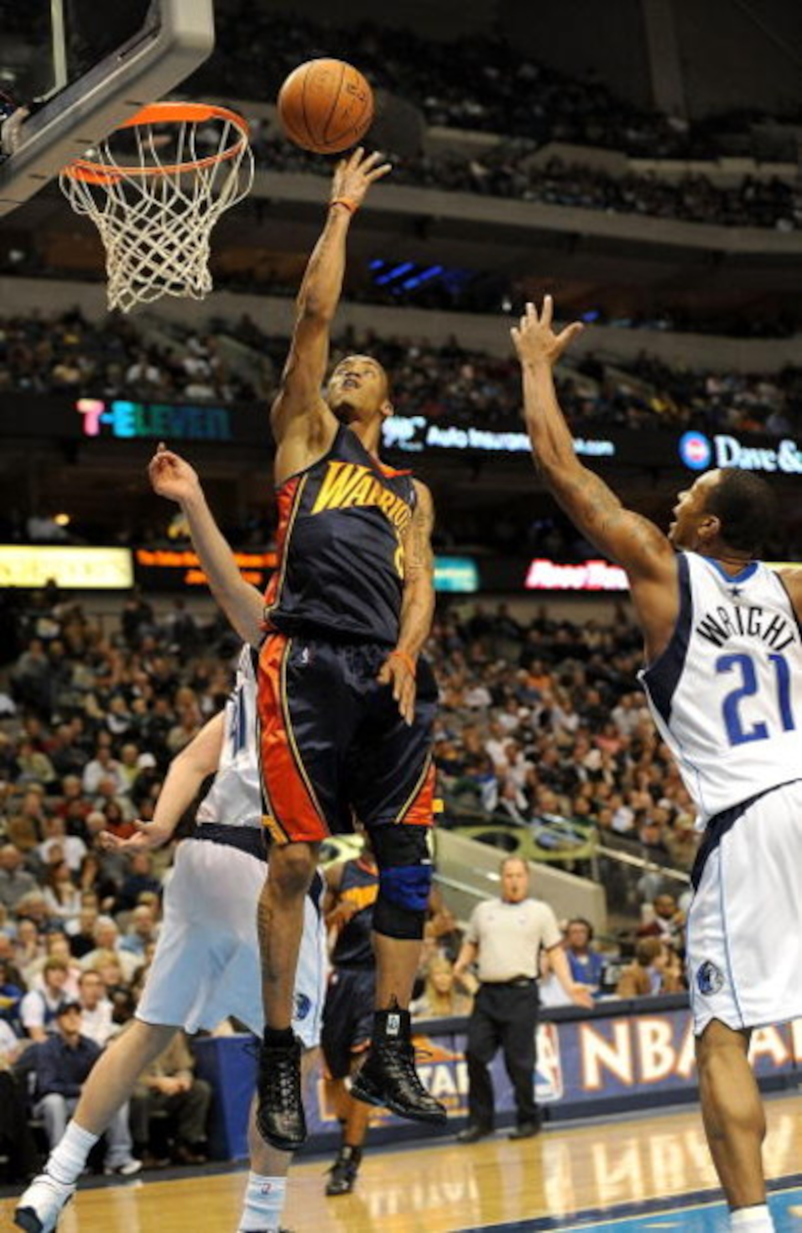 DALLAS - JANUARY 28: Guard Monta Ellis #8 of the Golden State Warriors takes a shot against the Dallas Mavericks on January 28, 2009 at American Airlines Center in Dallas, Texas. NOTE TO USER: User expressly acknowledges and agrees that, by downloading an