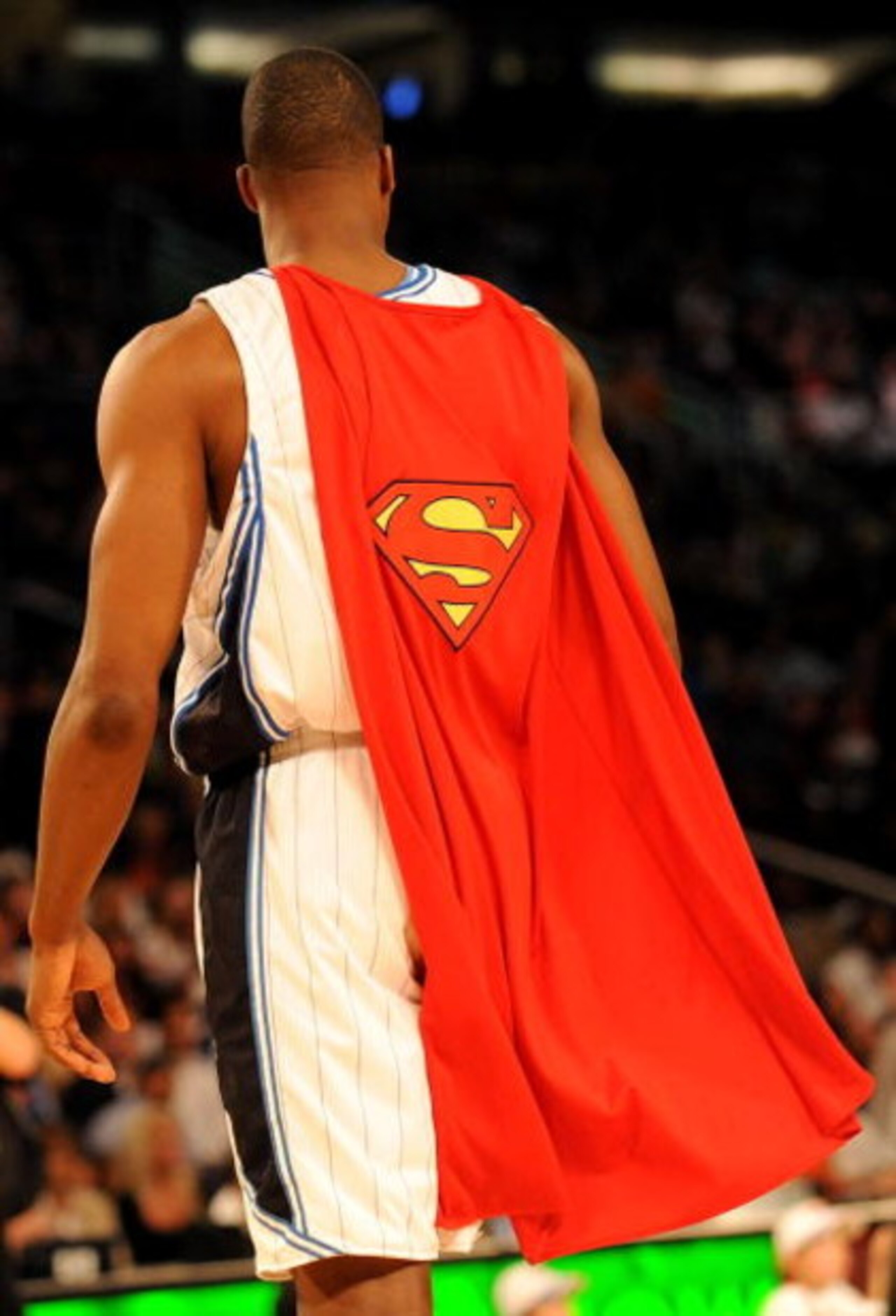 PHOENIX - FEBRUARY 14:  Dwight Howard of the Orlando Magic wears a Superman cape during the Sprite Slam Dunk Contest on All-Star Saturday Night, part of 2009 NBA All-Star Weekend at US Airways Center on February 14, 2009 in Phoenix, Arizona.  NOTE TO USER