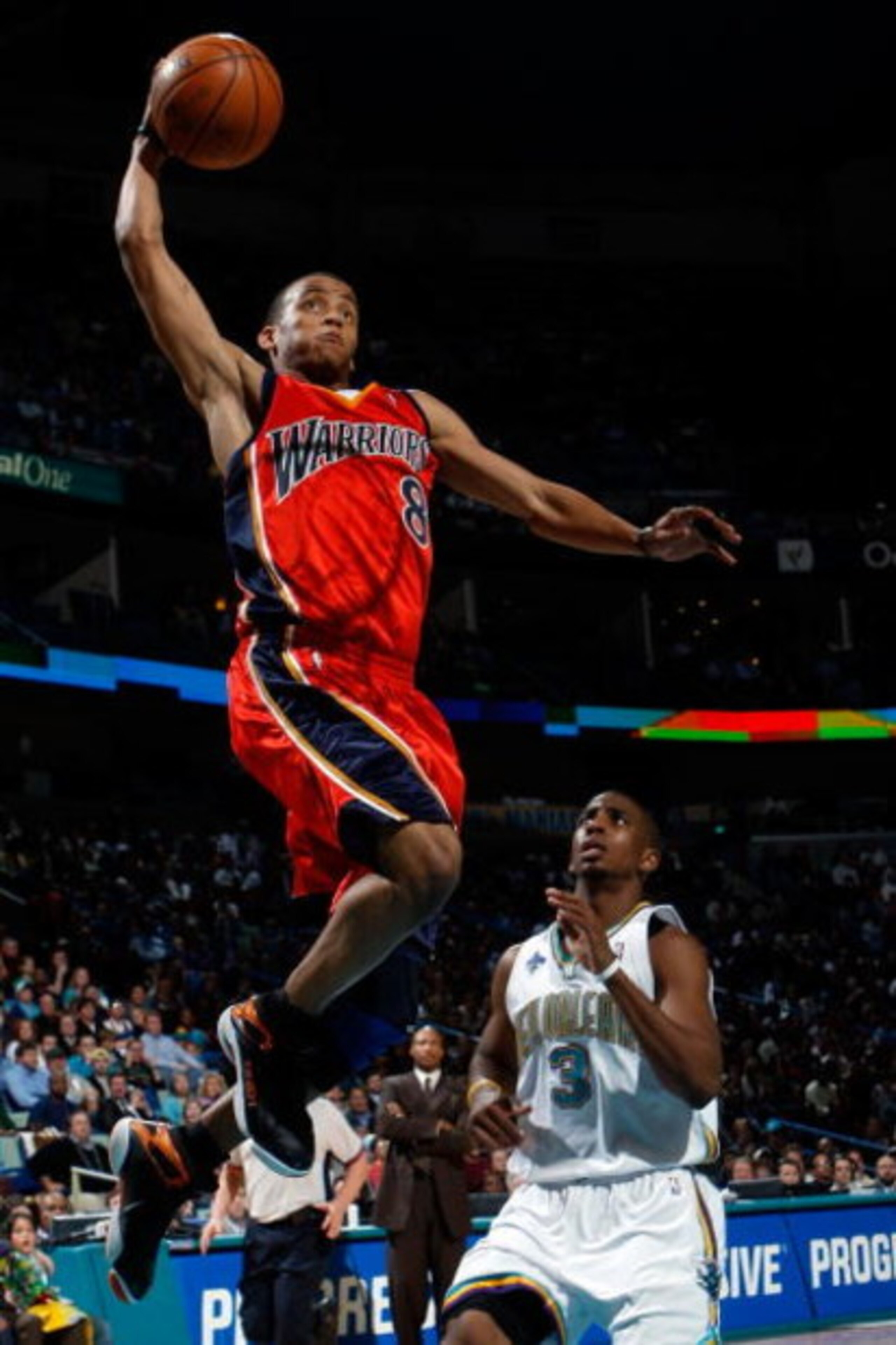 NEW ORLEANS - JANUARY 30:  Monta Ellis #8 of the Golden State Warriors dunks the ball over Chris Paul #3 of the New Orleans Hornets on January 30, 2008 at the New Orleans Arena in New Orleans, Louisiana.  The Warriors defeated the Hornets 116-103.    NOTE