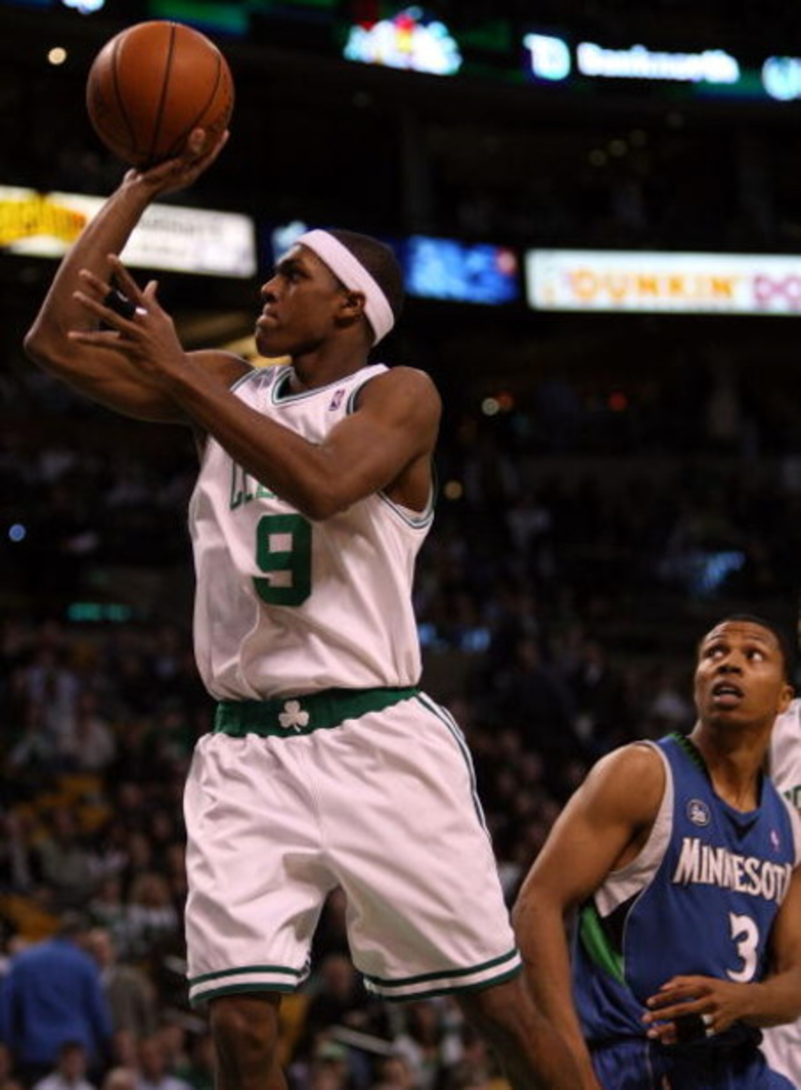 BOSTON - FEBRUARY 01:  Rajon Rondo #9 of the Boston Celtics makes the shot past Sebastian Telfair #3 of Minnesota Timberwolves on February 1, 2009 at TD Banknorth Garden in Boston, Massachusetts. The Celtics defeated the Minnesota Timberwolves 109-101. NO