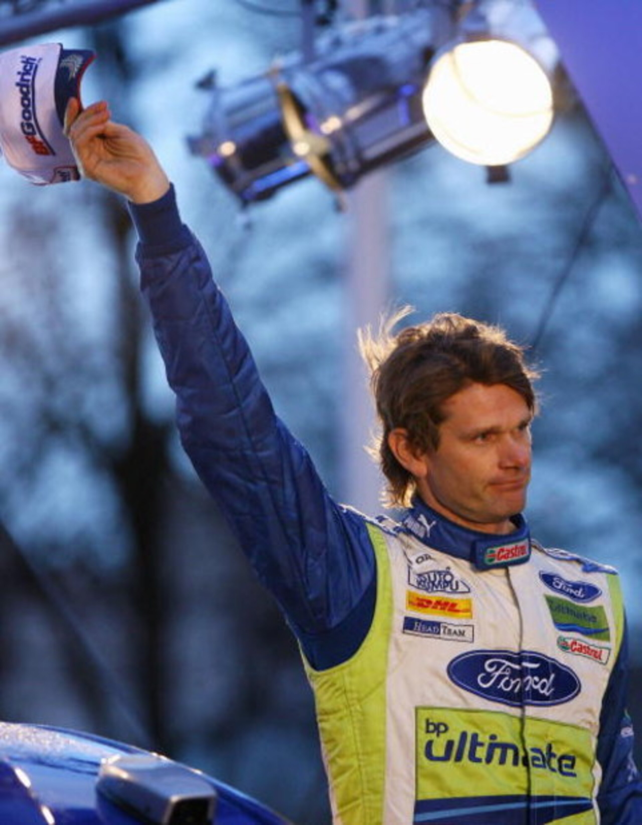 CARDIFF, UNITED KINGDOM - DECEMBER 02:  Marcus Gronholm of Finland and Ford waves to the fans after completing his last rally during the Podium Finish of the 2007 FIA Wales Rally GB on December 2, 2007 Cardiff, Wales.  (Photo by Ryan Pierse/Getty Images)