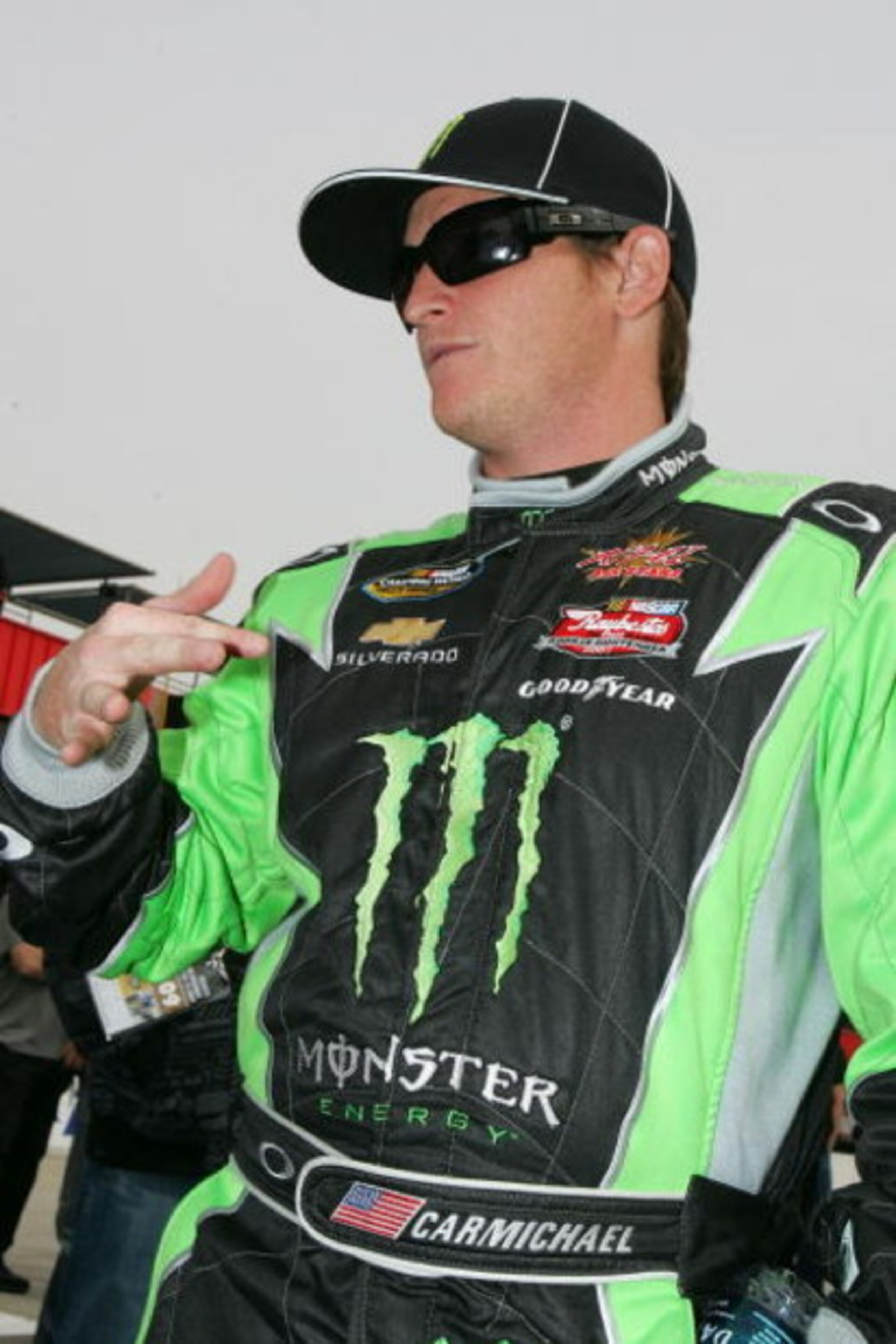 FONTANA, CA - FEBRUARY 21:  Ricky Carmichael, driver of the #4 Monster Energy Chevrolet, waits by his car before the NASCAR Camping World Truck Series San Bernardino County 200 at Auto Club Speedway on February 21, 2009 in Fontana, California.  (Photo by 