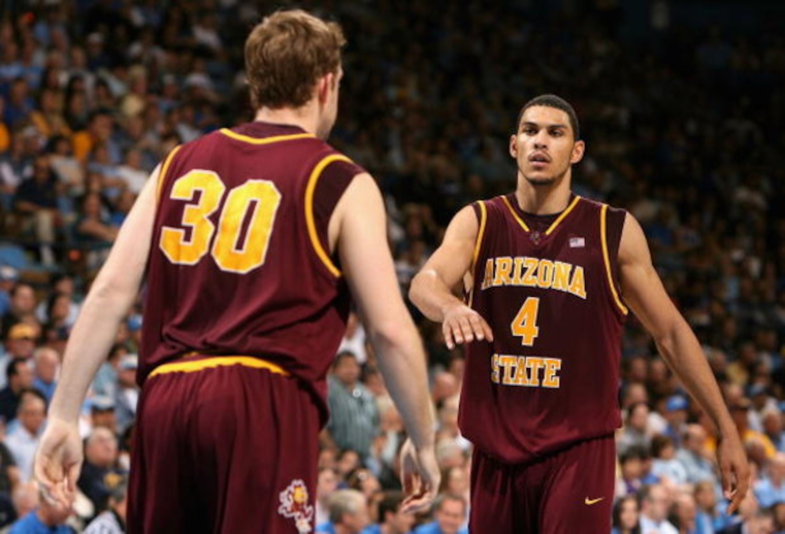 WESTWOOD, CA - JANUARY 17:  Jeff Pendergraph #4 of the Arizona State Sun Devils celebrates with teammate Rihards Kuksiks #30 after a three point play against the UCLA Bruins during the college basketball game at Pauley Pavilion on January 17, 2009 in West