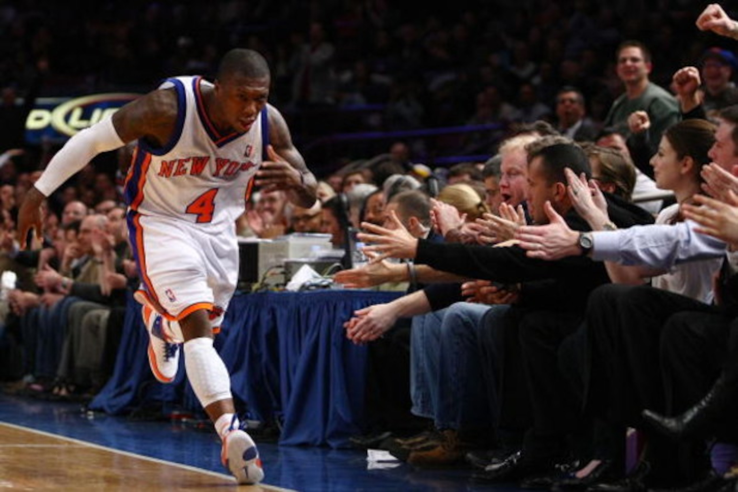 NEW YORK - FEBRUARY 23:  Nate Robinson #4 of the New York Knicks high-fives the crowd after scoring a basket against the Indiana Pacers at Madison Square Garden February 23, 2009 in New York City. NOTE TO USER: User expressly acknowledges and agrees that,