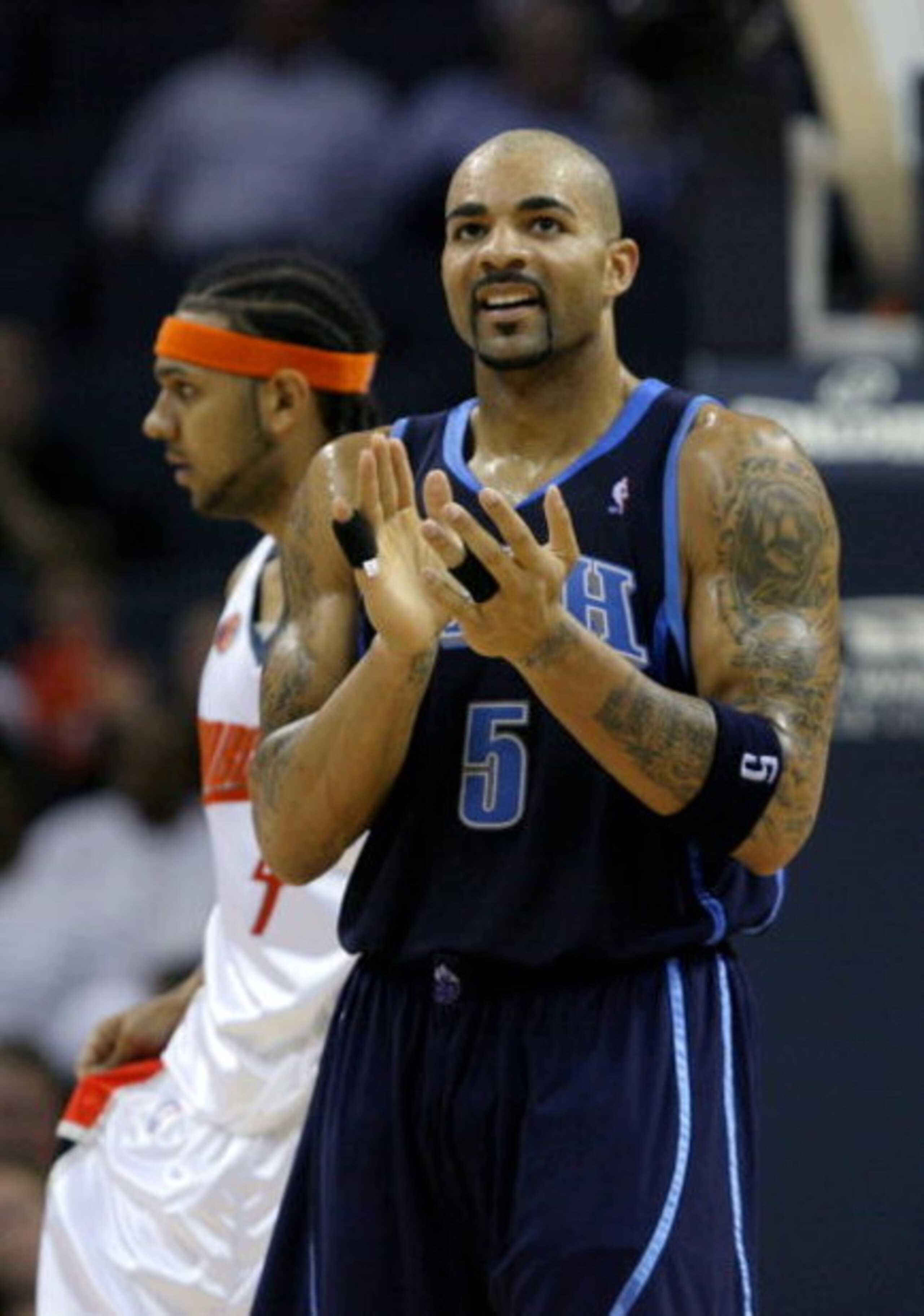 CHARLOTTE, NC - NOVEMBER 14:  Carlos Boozer #5 of the Utah Jazz celebrates after a basket in front of Jared Dudley #4 of the Charlotte Bobcats during their game at Time Warner Cable Arena on November 14, 2008 in Charlotte, North Carolina.  (Photo by Stree