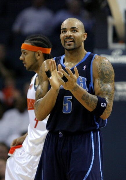 CHARLOTTE, NC - NOVEMBER 14:  Carlos Boozer #5 of the Utah Jazz celebrates after a basket in front of Jared Dudley #4 of the Charlotte Bobcats during their game at Time Warner Cable Arena on November 14, 2008 in Charlotte, North Carolina.  (Photo by Stree