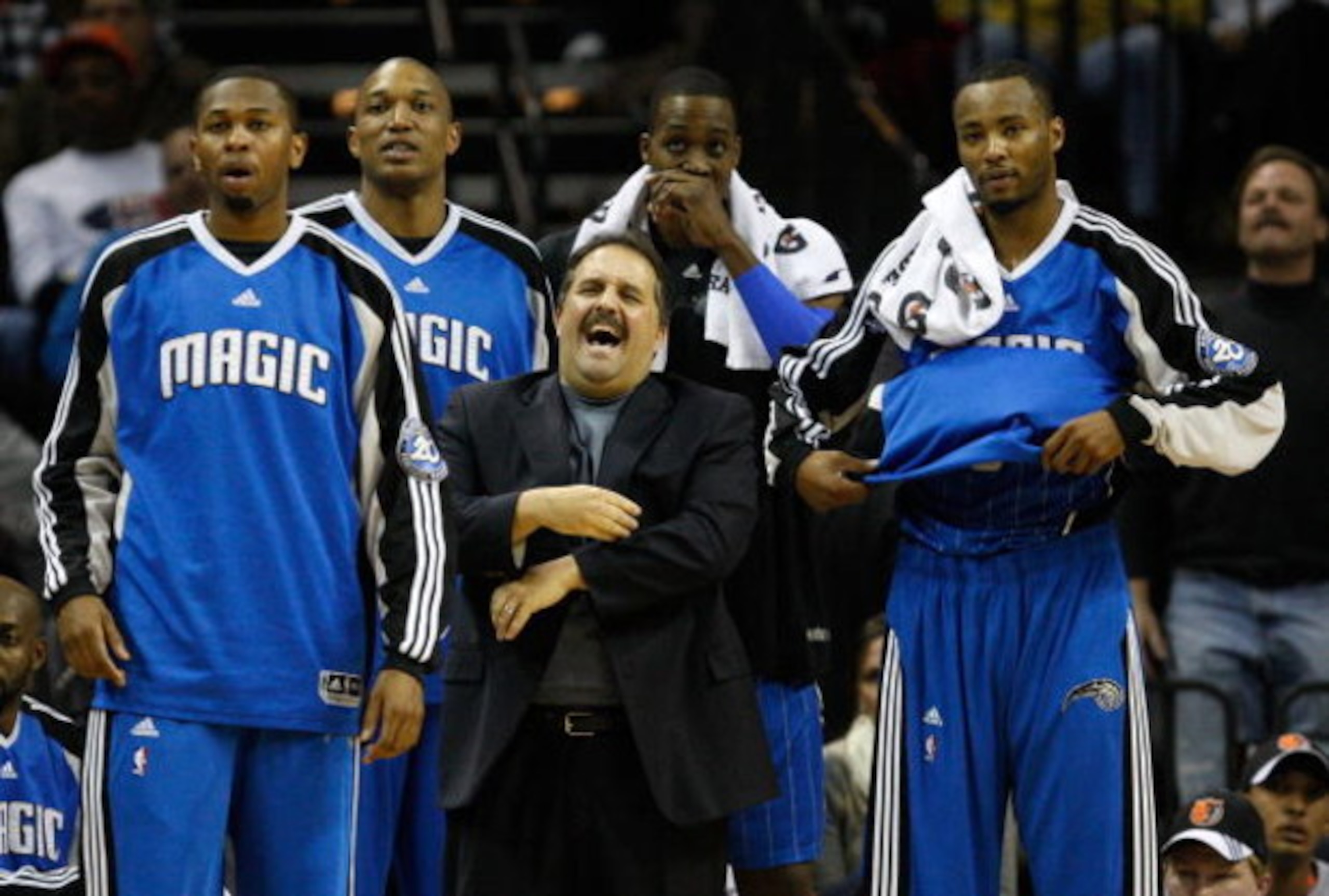 CHARLOTTE, NC - FEBRUARY 20:  Head coach Stan Van Gundy of the Orlando Magic reacts with players Jeremy Richardson #32 Tony Battie #4 Dwight Howard #12 and Rashard Lewis #8 during their game against the Charlotte Bobcats at Time Warner Cable Arena on Febr