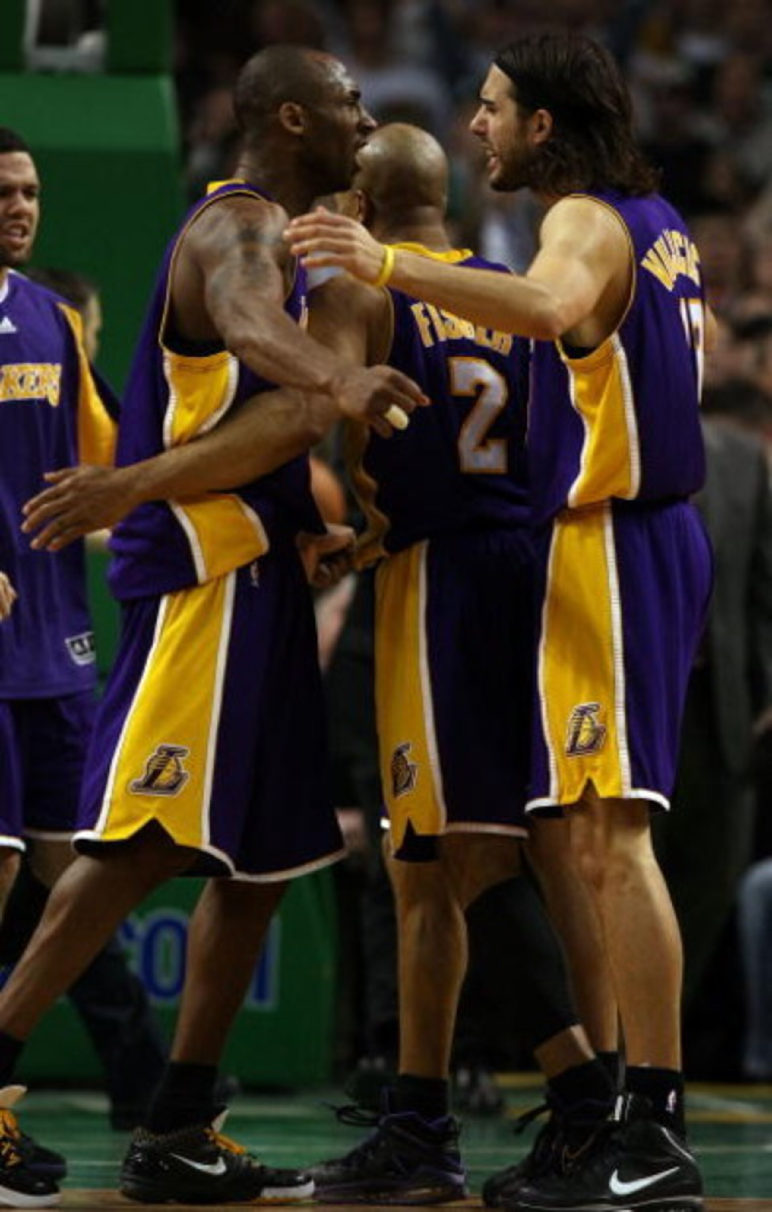 BOSTON - FEBRUARY 05:  Kobe Bryant #24, Derek Fisher #2 and Sasha Vujacic #18 of Los Angeles Lakers celebrate their overtime win against the Boston Celtics on February 5, 2009 at TD Banknorth Garden in Boston, Massachusetts. The Lakers defeated the Celtic