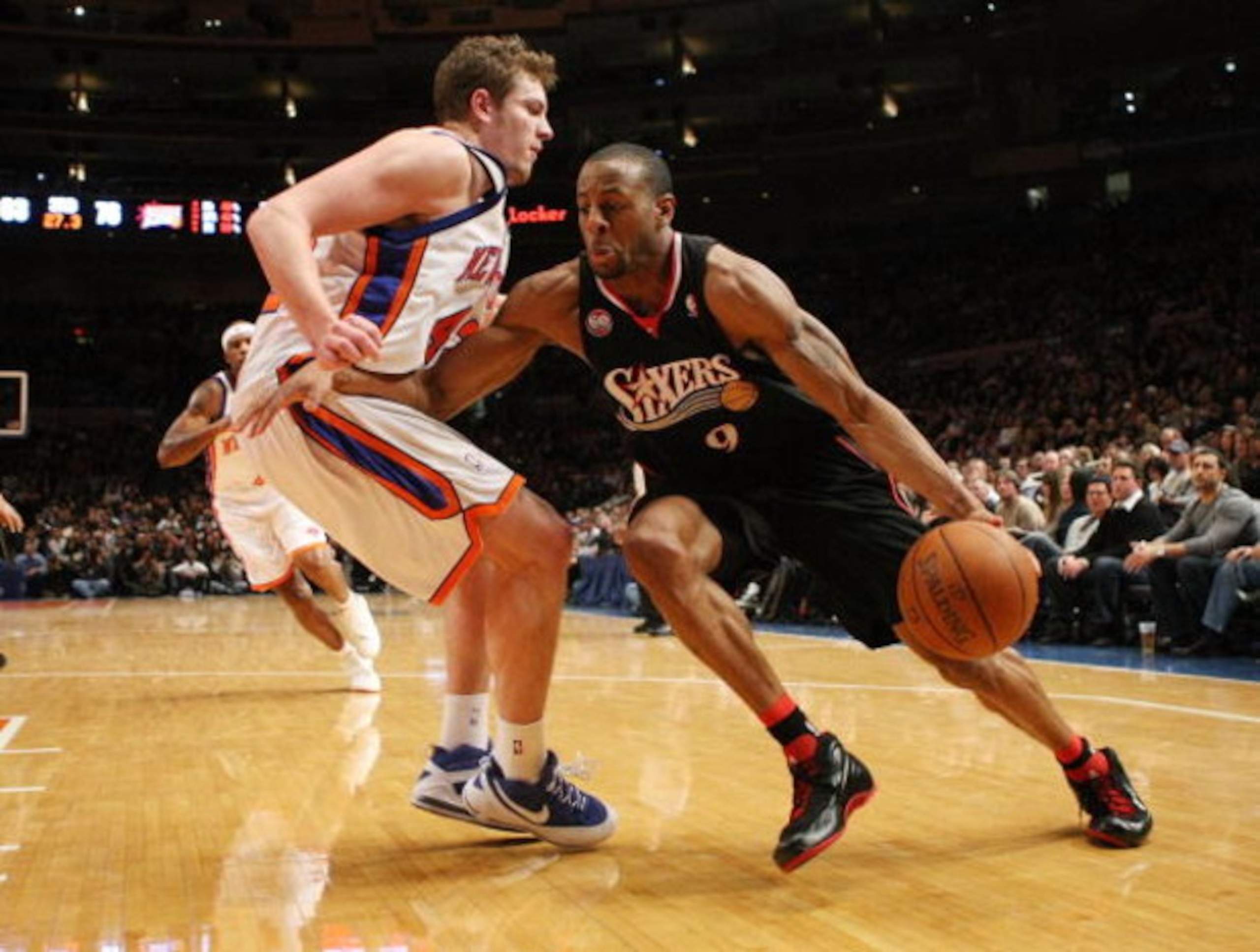 NEW YORK - JANUARY 17: Andre Iguodala #9 of the Philadelphia 76ers drives to the basket against David Lee #42 of the New York Knicks on January 17, 2009 at Madison Square Garden in New York City, New York. NOTE TO USER: User expressly acknowledges and agr
