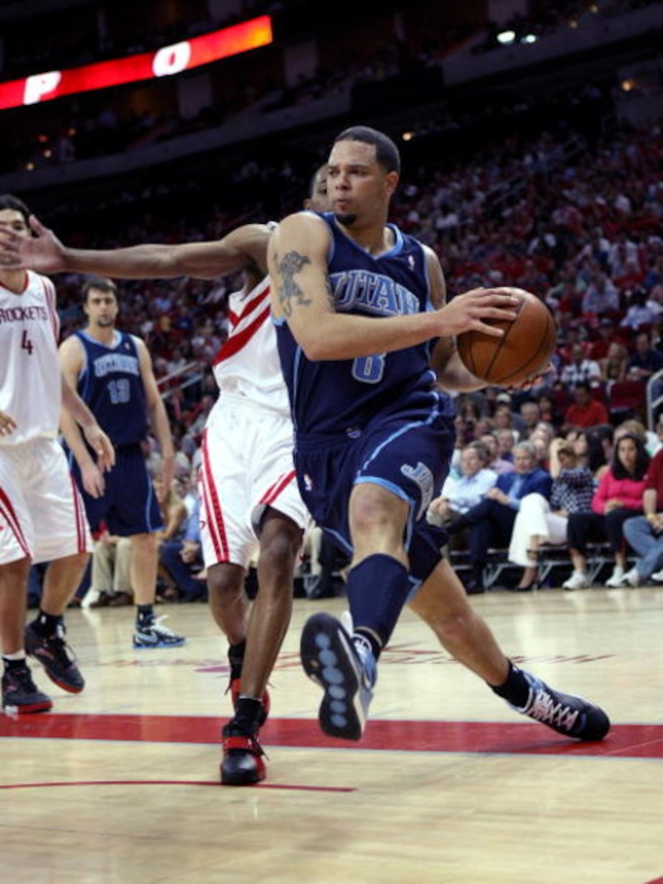 HOUSTON - APRIL 29:  Deron Williams #8 of the Utah Jazz drives through the lane against the Houston Rockets in Game Five of the Western Conference Quarterfinals during the 2008 NBA Playoffs at the Toyota Center on April 29, 2008 in Houston, Texas.  The Ja