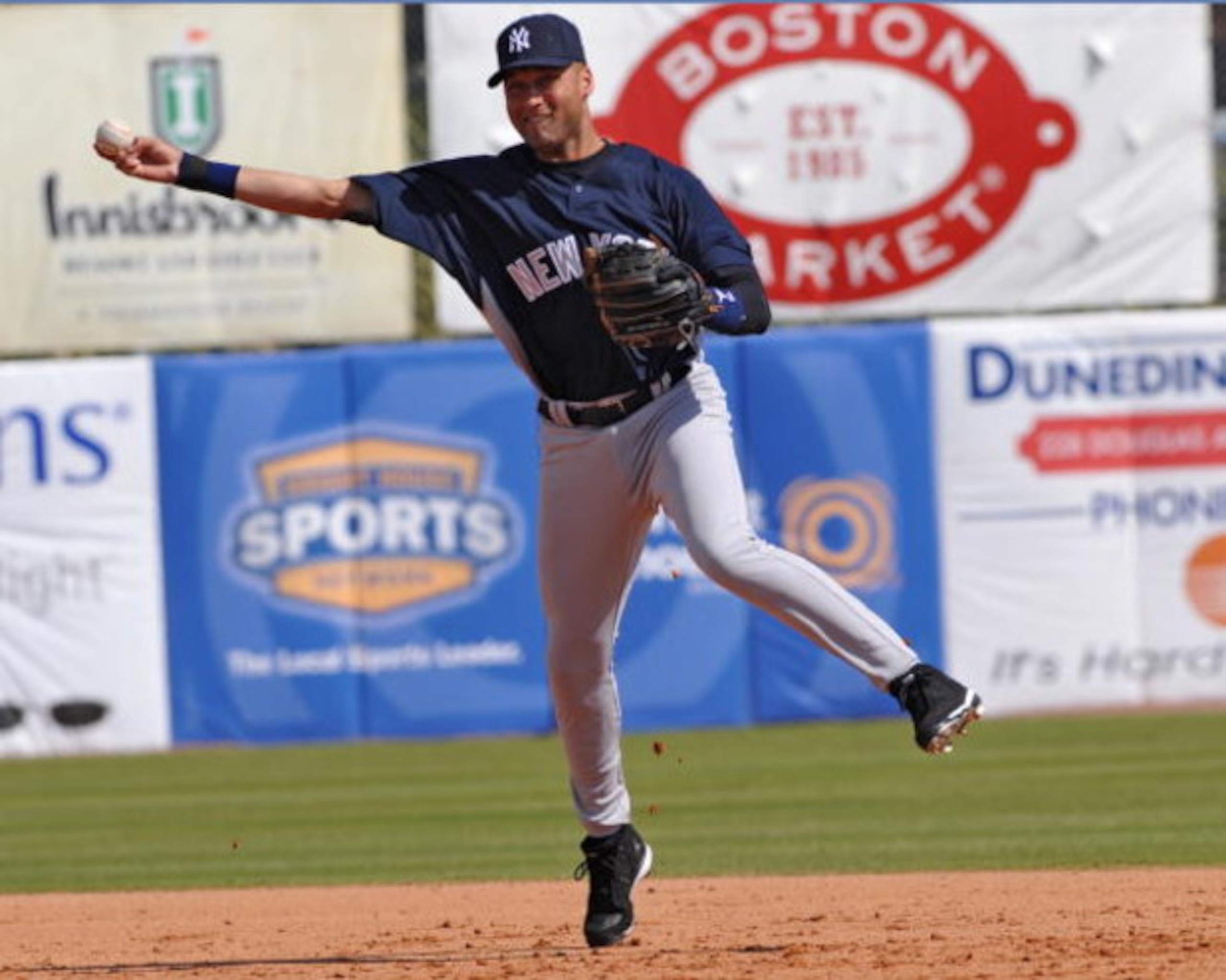 DUNEDIN, FL - FEBRUARY 25 :  Infielder Derek Jeter of the New York Yankees throws out a runner against the Toronto Blue Jays February 25, 2009 at Dunedin Stadium in Dunedin, Florida.  (Photo by Al Messerschmidt/Getty Images)