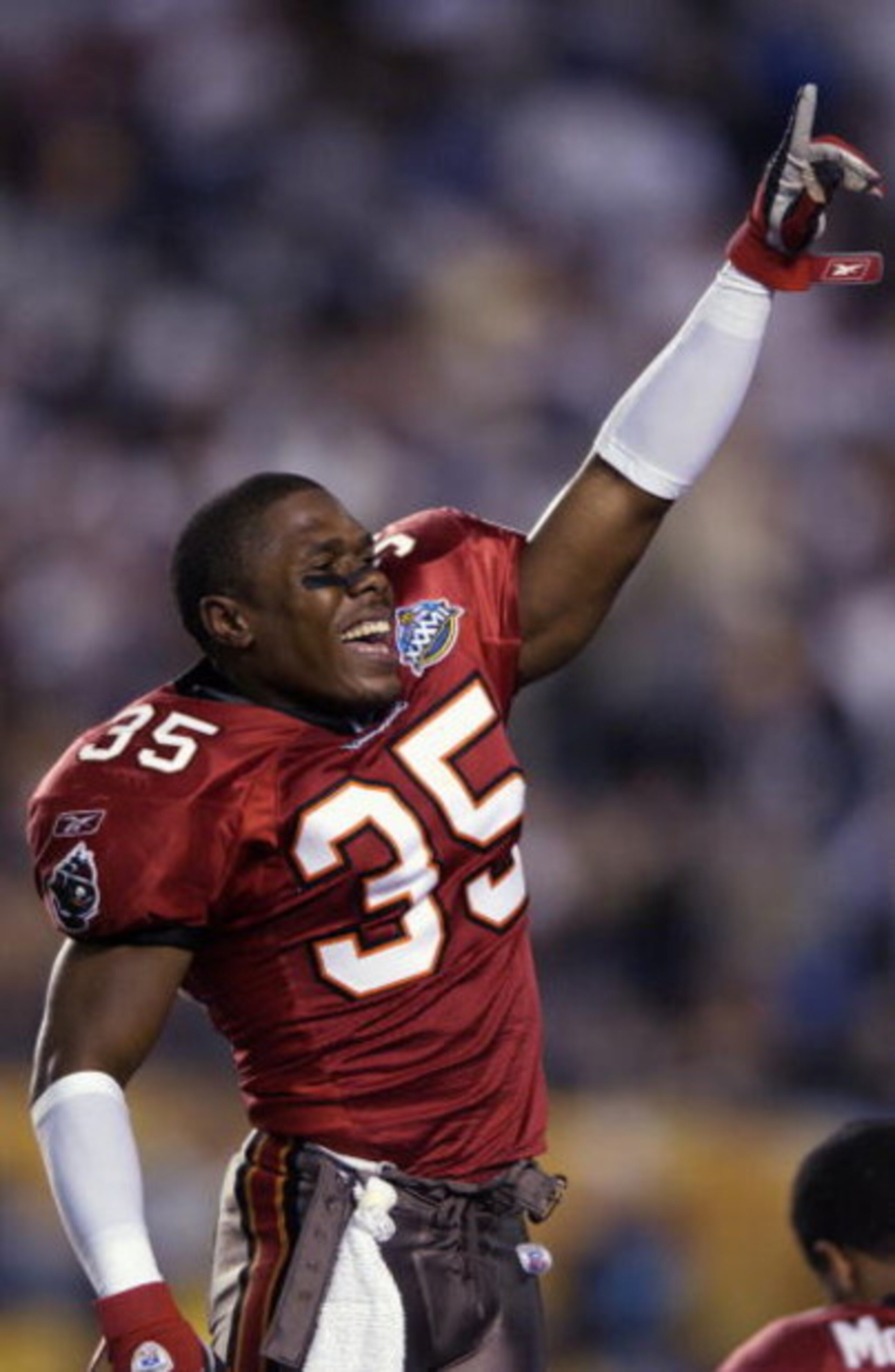 SAN DIEGO - JANUARY 26:  Corey Ivy #35 of the Tampa Bay Buccaneers celebrates the victory over the Oakland Raiders in Super Bowl XXXVII on January 26, 2003 at Qualcomm Stadium in San Diego, California.  The Buccaneers won 48-21.  (Photo by Ezra Shaw/Getty