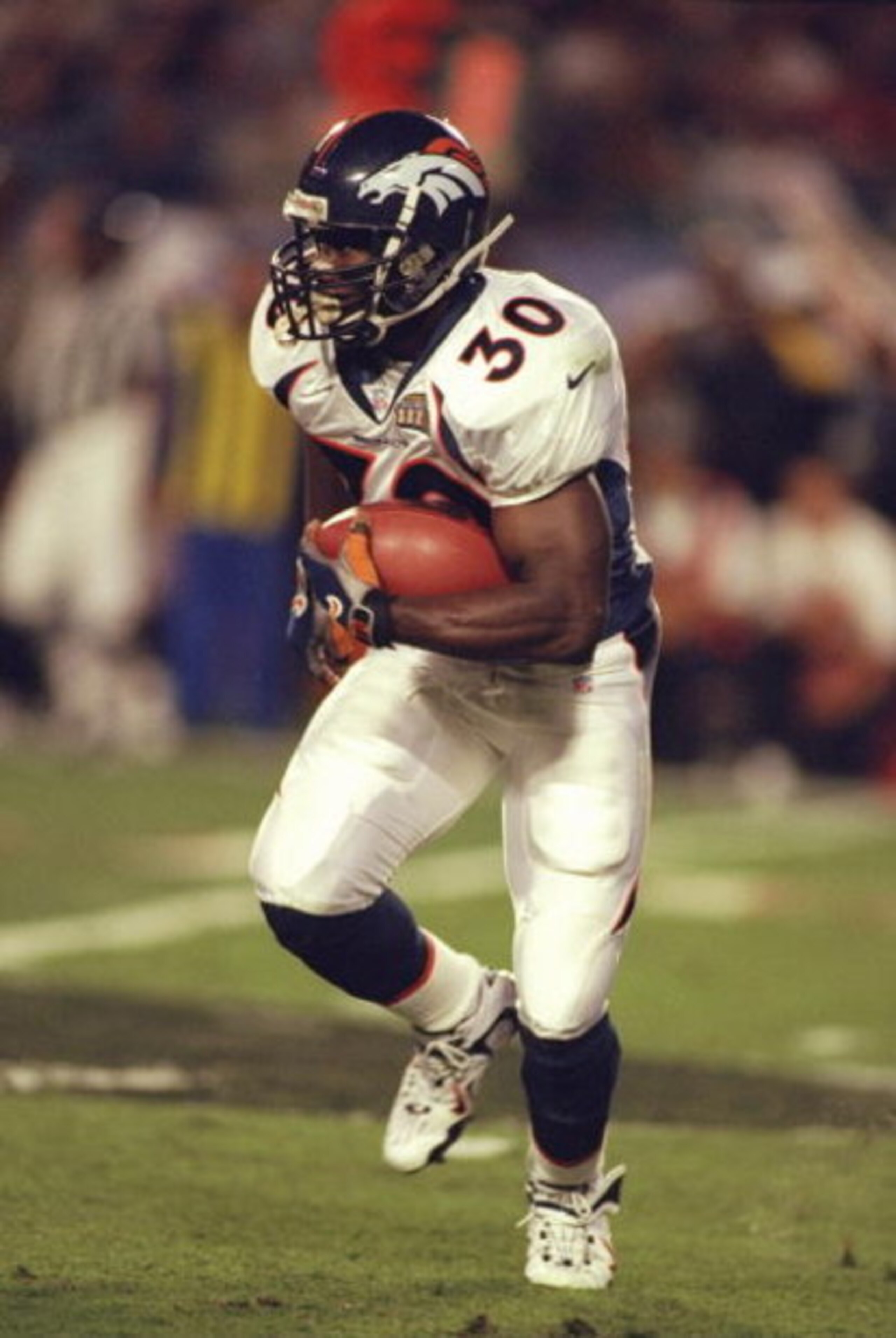 31 Jan 1999: Terrell Davis #30 of the Denver Broncos carries the ball during the Superbowl XXXIII against the Atlanta Falcons at the Pro Player Stadium in Miami, Florida. The Broncos defeated the Falcons 34-19. Mandatory Credit: Al Bello  /Allsport