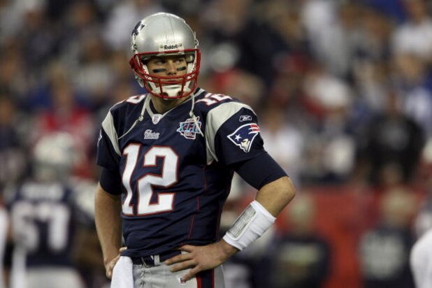 GLENDALE, AZ - FEBRUARY 03: Quarterback Tom Brady #12 of the New England Patriots looks on during Super Bowl XLII against the New York Giants on February 3, 2008 at the University of Phoenix Stadium in Glendale, Arizona. The Giants defeated the Patriots GLENDALE, AZ - FEBRUARY 03: Quarterback Tom Brady #12 of the New England Patriots looks on during Super Bowl XLII against the New York Giants on February 3, 2008 at the University of Phoenix Stadium in Glendale, Arizona. The Giants defeated the Patriots