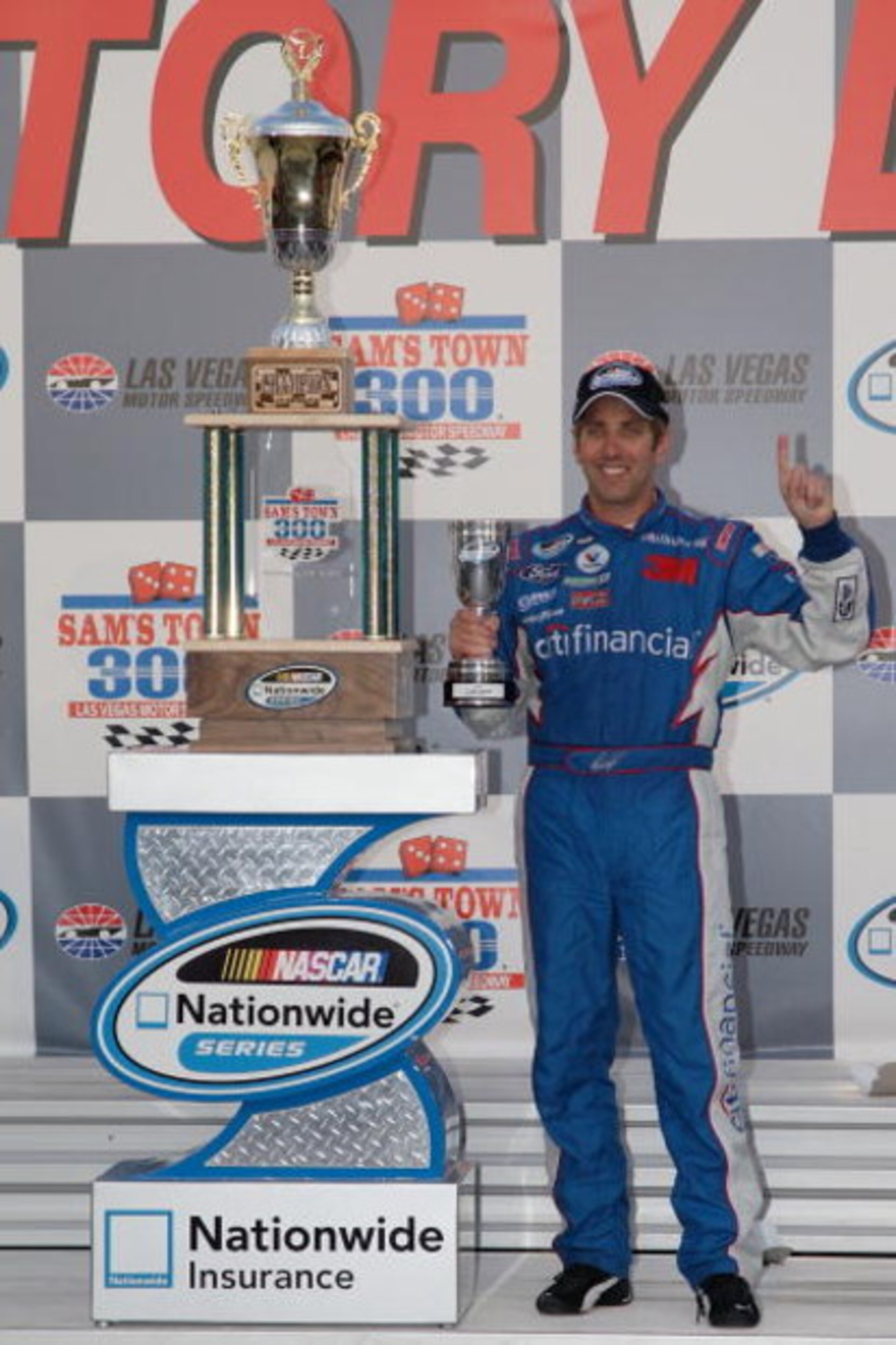 LAS VEGAS - FEBRUARY 28: Greg Biffle, driver of the #16 citifinancial Ford poses with the trophies in victory lane after winning the NASCAR Nationwide Series Sam's Town 300 at the Las Vegas Motor Speedway on February 28, 2009 in Las Vegas, Nevada. (Phot LAS VEGAS - FEBRUARY 28: Greg Biffle, driver of the #16 citifinancial Ford poses with the trophies in victory lane after winning the NASCAR Nationwide Series Sam's Town 300 at the Las Vegas Motor Speedway on February 28, 2009 in Las Vegas, Nevada. (Phot