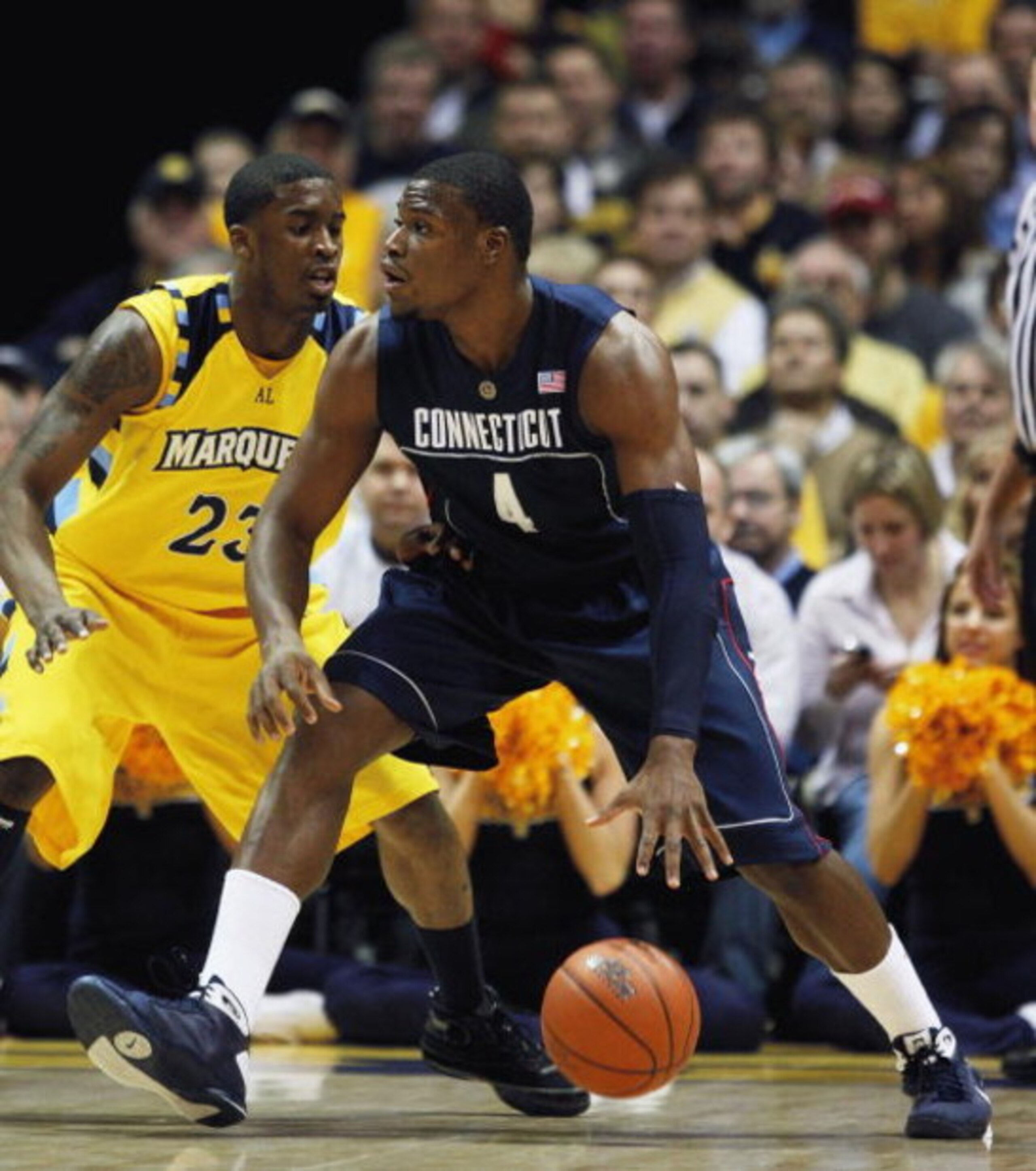 MILWAUKEE - FEBRUARY 25: Jeff Adrien #4 of the Connecticut Huskies moves against Wesley Matthews #23 of the Marquette Golden Eagles on February 25, 2009 at the Bradley Center in Milwaukee, Wisconsin. Connecticut defeated Marquette 93-82. (Photo by Jonatha