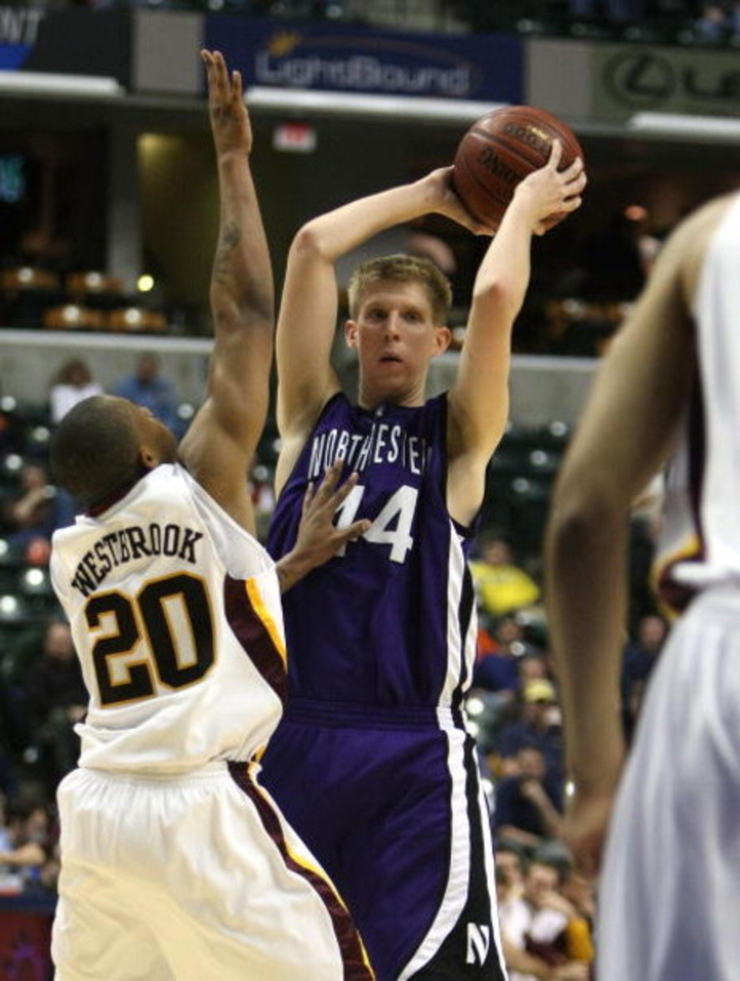 INDIANAPOLIS - MARCH 13:  Kevin Coble #44 of the Northwestern Wildcats looks to pass against Lawrence Westbrook #20 of the Minnesota Golden Gophers during the Big Ten Men's Basketball Tournament at Conseco Fieldhouse on March 13, 2008 in Indianapolis, Ind