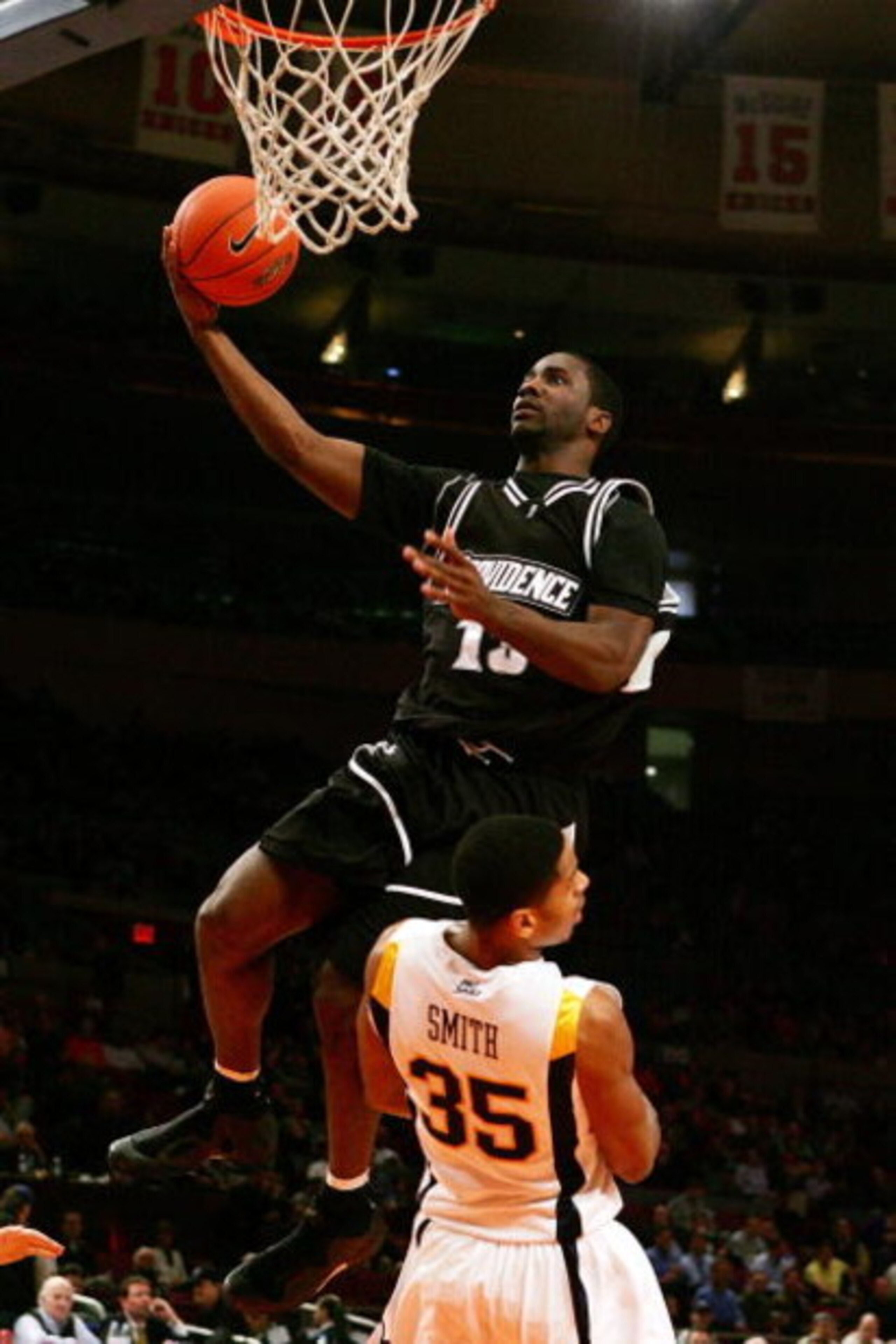 NEW YORK - MARCH 12:  Weyinmi Efejuku #13 of the Providence Friars goes to the hoop against Wellington Smith #35 of the West Virginia Mountaineers during the 2008 Big East Men's Basketball Championship at Madison Square Garden on March 12, 2008 in New Yor