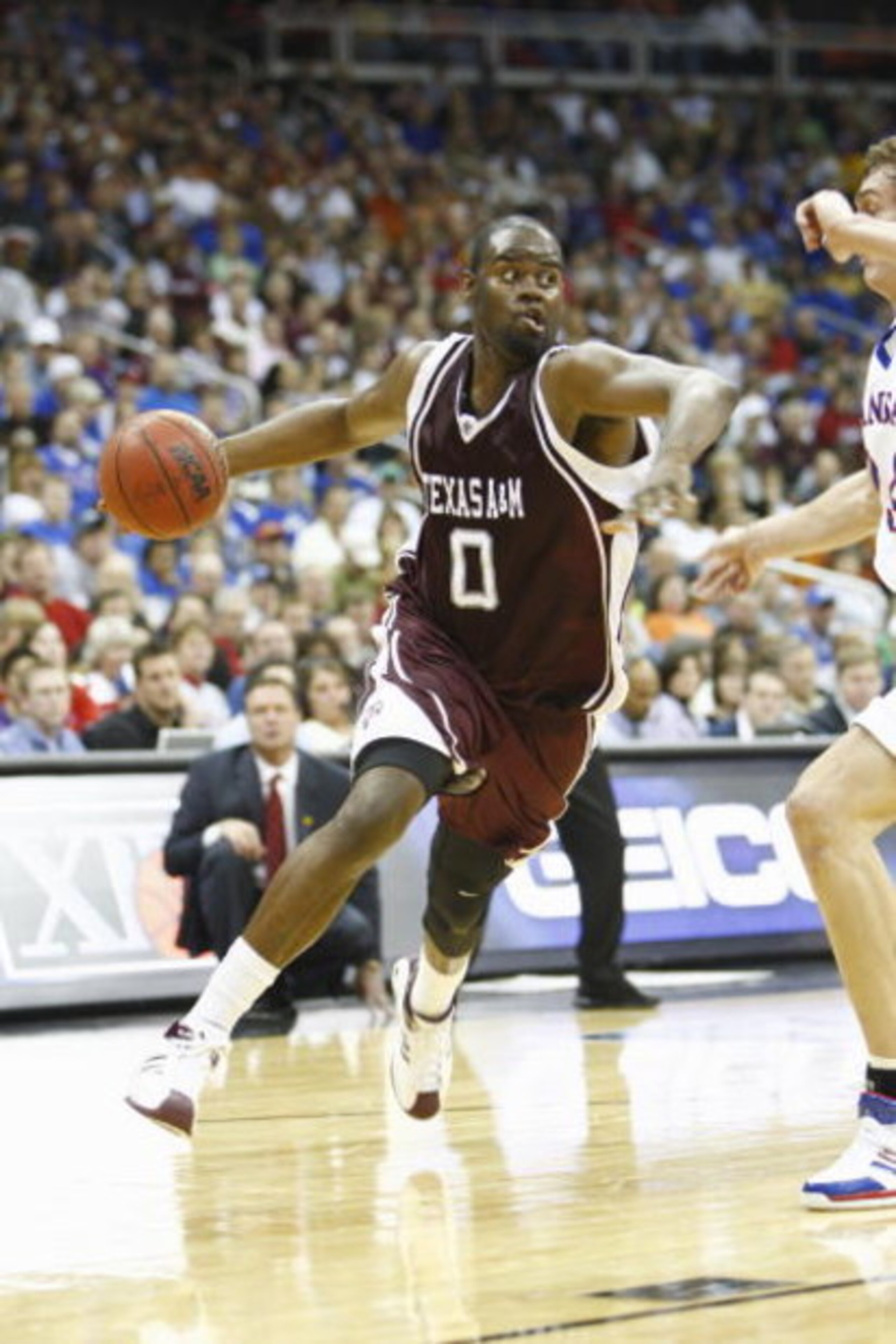 KANSAS CITY, MO - MARCH 15:  Bryan Davis #0 of the Texas A&M Aggies dribbles against the Kansas Jayhawks during the semifinal game of the Big 12 Men's Basketball Tournament on March 15, 2008 at the Sprint Center in Kansas City, Missouri.  (Photo by Jamie 