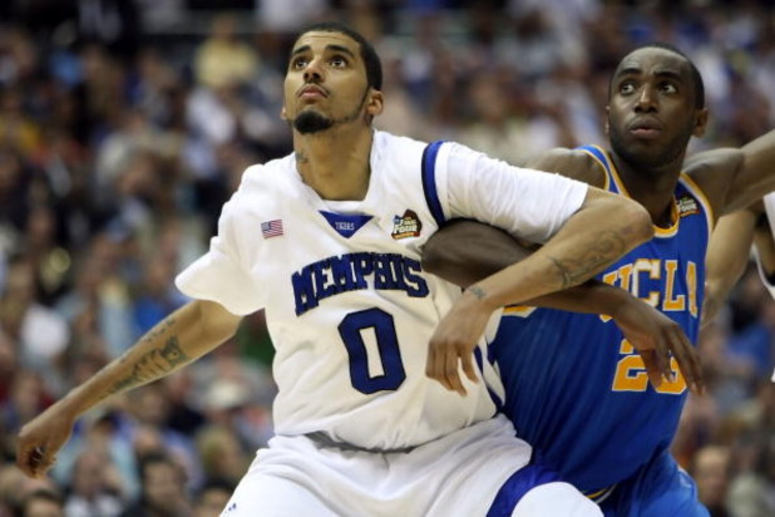 SAN ANTONIO - APRIL 05:  Shawn Taggart #0 of the Memphis Tigers boxes out Luc Richard Mbah a Moute #23 of the UCLA Bruins during the National Semifinal game of the NCAA Men's Final Four at the Alamodome on April 5, 2008 in San Antonio, Texas.  (Photo by J