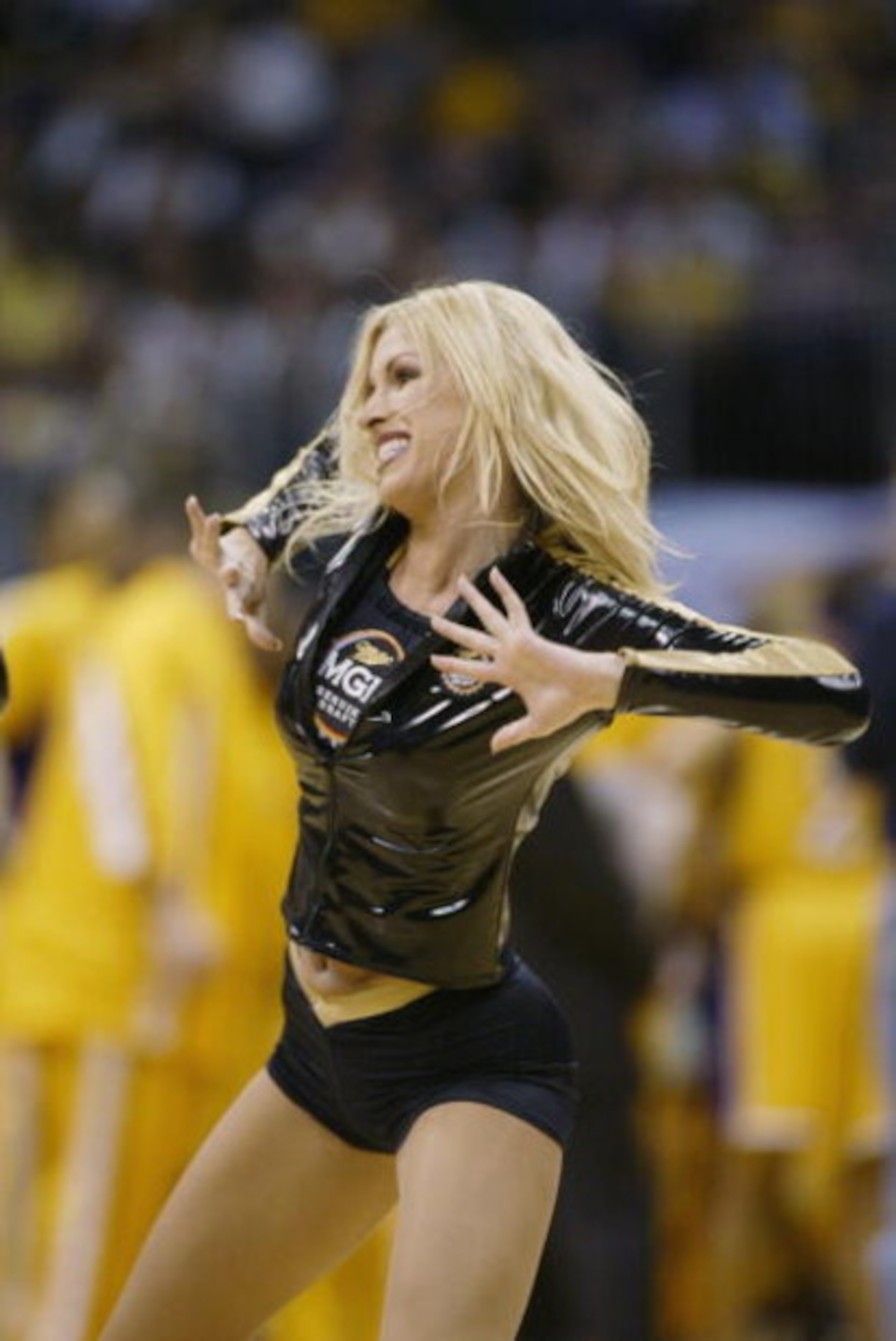 LOS ANGELES - MAY 24: A Laker cheerleader performs during a break in Game three of the Western Conference Finals during the 2002 NBA Playoffs beteween the the Los Angeles Lakers and the Sacramento Kings at Staples Center in Los Angeles, California on May LOS ANGELES - MAY 24: A Laker cheerleader performs during a break in Game three of the Western Conference Finals during the 2002 NBA Playoffs beteween the the Los Angeles Lakers and the Sacramento Kings at Staples Center in Los Angeles, California on May