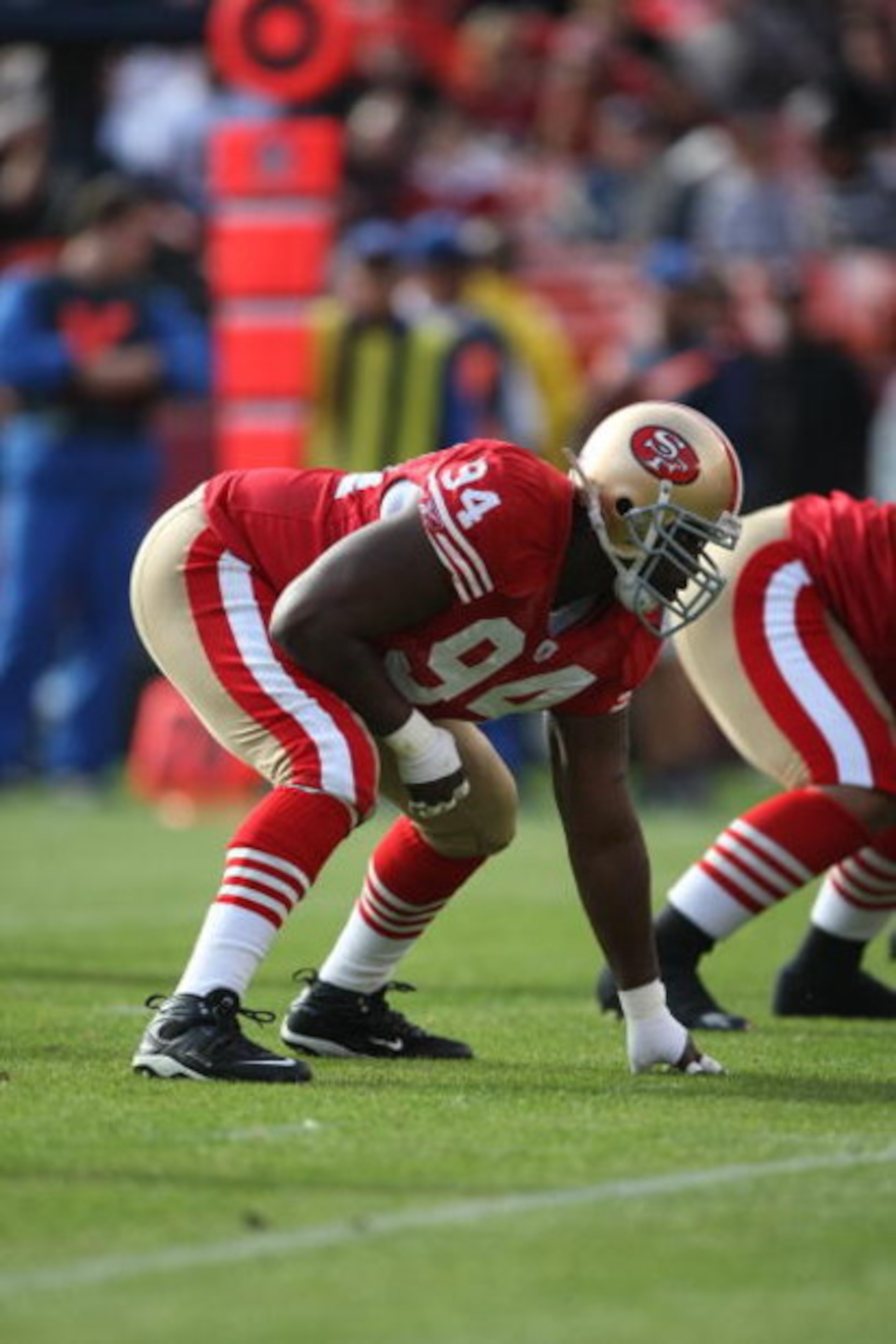 SAN FRANCISCO - NOVEMBER 18:  Marques Douglas #94 of the San Francisco 49ers lines up for a play against the St. Louis Rams on November 18, 2007 at Monster Park in San Francisco, California. (Photo by Jed Jacobsohn/Getty Images)