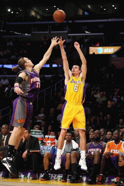 LOS ANGELES, CA - FEBRUARY 26:  Adam Morrison #6 of the Los Angeles Lakers shoots a three point shot over Louis Amundson #17 of the Phoenix Suns during the NBA game at Staples Center on February 26, 2009 in Los Angeles, California.   The Lakers defeated t