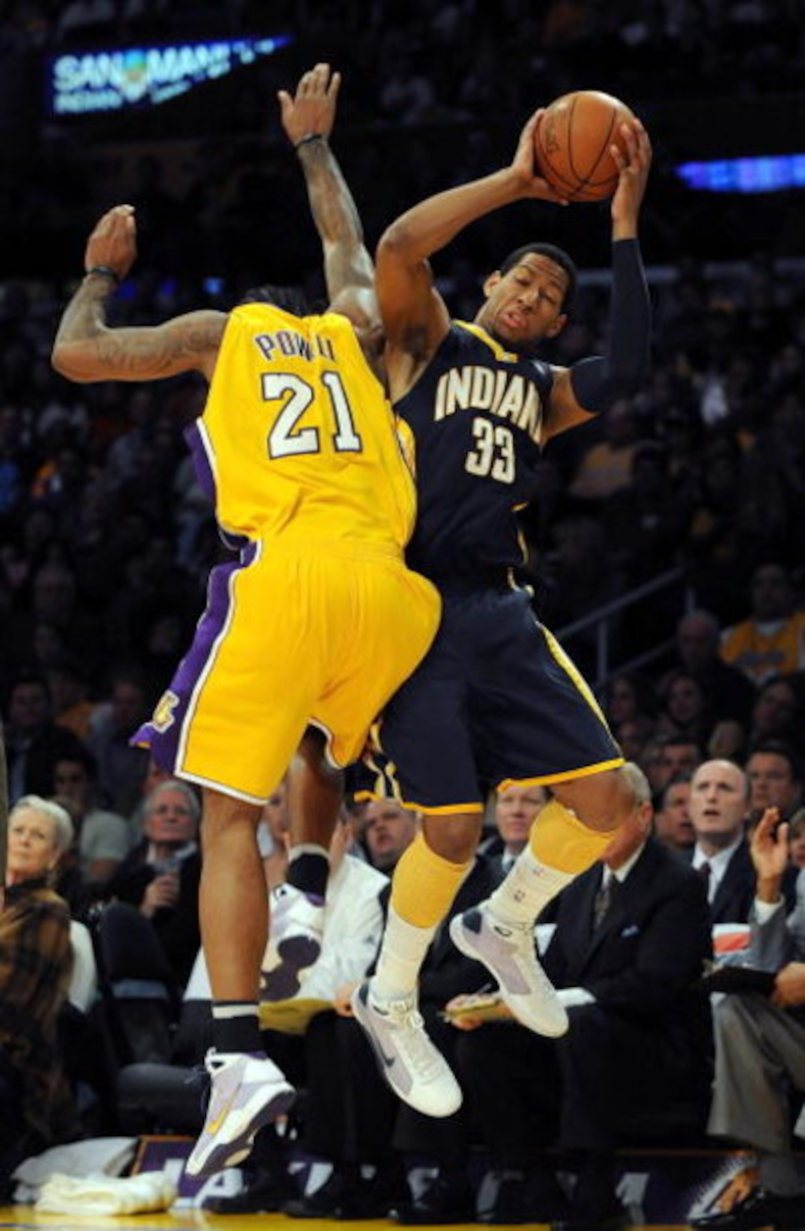 LOS ANGELES, CA - JANUARY 09: Danny Granger #33 of the Indiana Pacers is fouled by Josh Powell #21 of the Los Angeles Lakers as he attempts a three pointer during the first half at the Staples Center on January 9, 2009 in Los Angeles, California. NOTE LOS ANGELES, CA - JANUARY 09: Danny Granger #33 of the Indiana Pacers is fouled by Josh Powell #21 of the Los Angeles Lakers as he attempts a three pointer during the first half at the Staples Center on January 9, 2009 in Los Angeles, California. NOTE