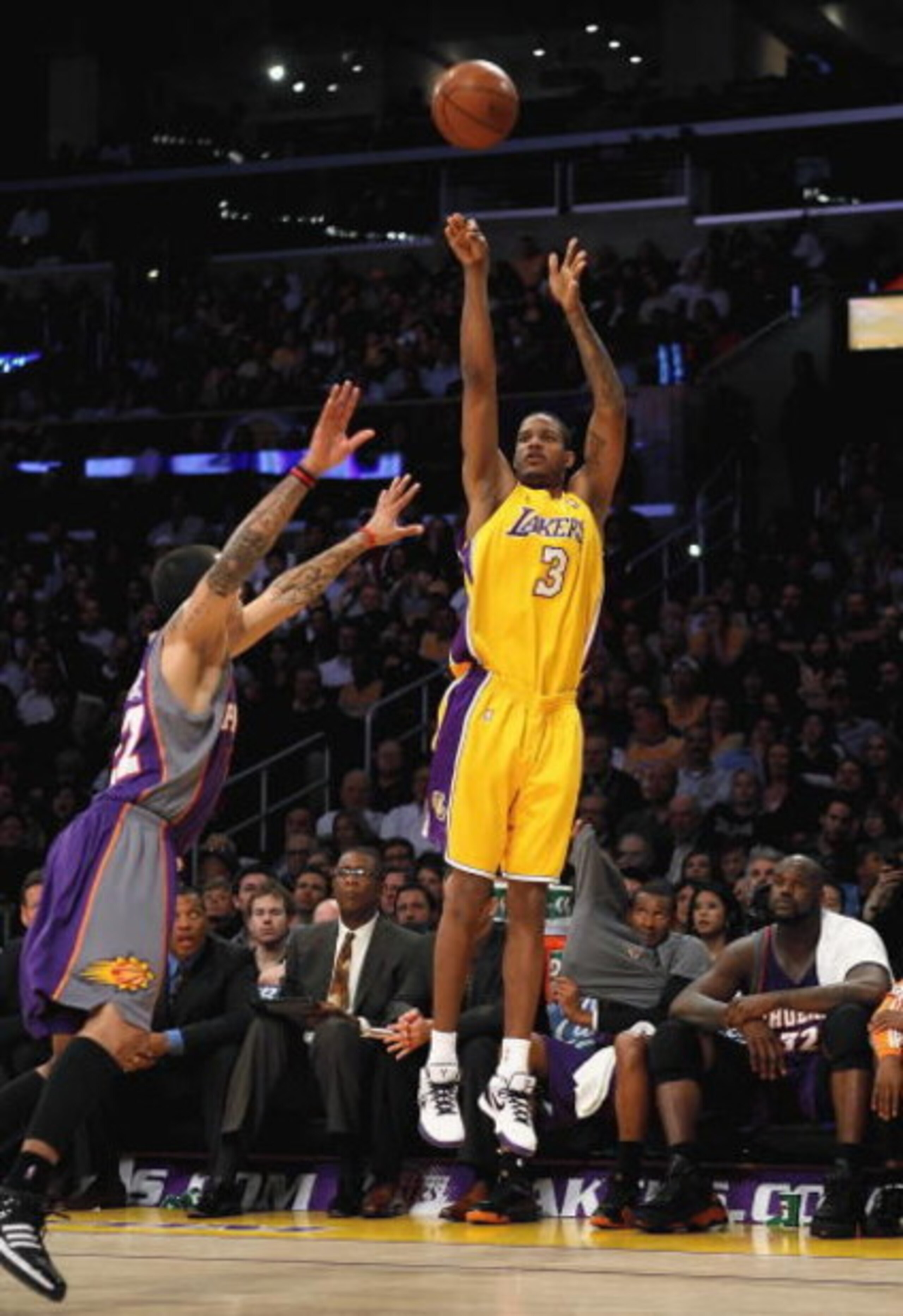 LOS ANGELES, CA - FEBRUARY 26: Trevor Ariza #3 of the Los Angeles Lakers shoots a three point shot over Matt Barnes #22 of the Phoenix Suns during the NBA game at Staples Center on February 26, 2009 in Los Angeles, California. The Lakers defeated the S LOS ANGELES, CA - FEBRUARY 26: Trevor Ariza #3 of the Los Angeles Lakers shoots a three point shot over Matt Barnes #22 of the Phoenix Suns during the NBA game at Staples Center on February 26, 2009 in Los Angeles, California. The Lakers defeated the S
