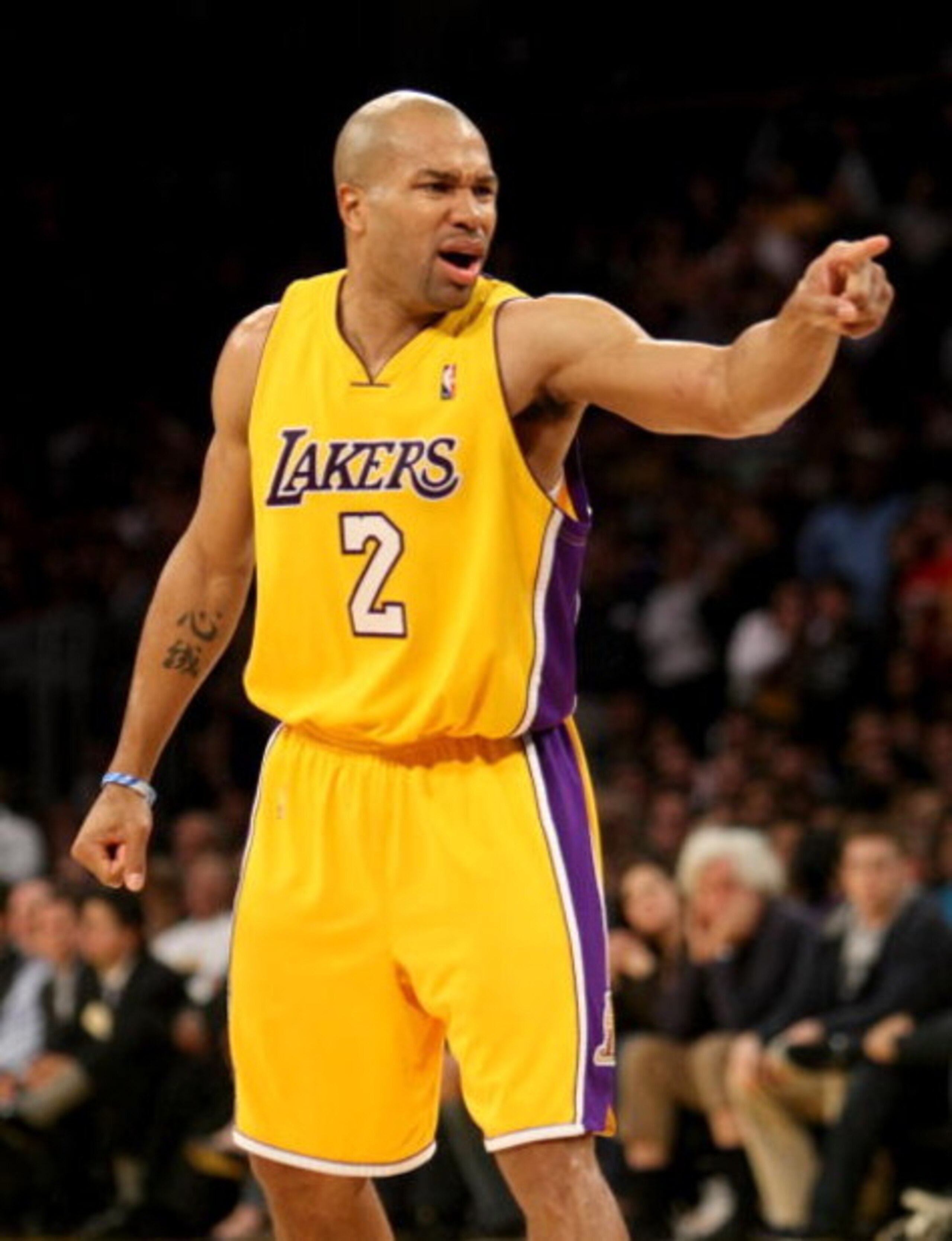 LOS ANGELES - JANUARY 27: Derek Fisher #2 of the Los Angeles Lakers points in the game with the Charlotte Bobcats on January 27, 2009 at Staples Center in Los Angeles, California. The Bobcats won 117-110 in double overtime. NOTE TO USER: User expressly LOS ANGELES - JANUARY 27: Derek Fisher #2 of the Los Angeles Lakers points in the game with the Charlotte Bobcats on January 27, 2009 at Staples Center in Los Angeles, California. The Bobcats won 117-110 in double overtime. NOTE TO USER: User expressly
