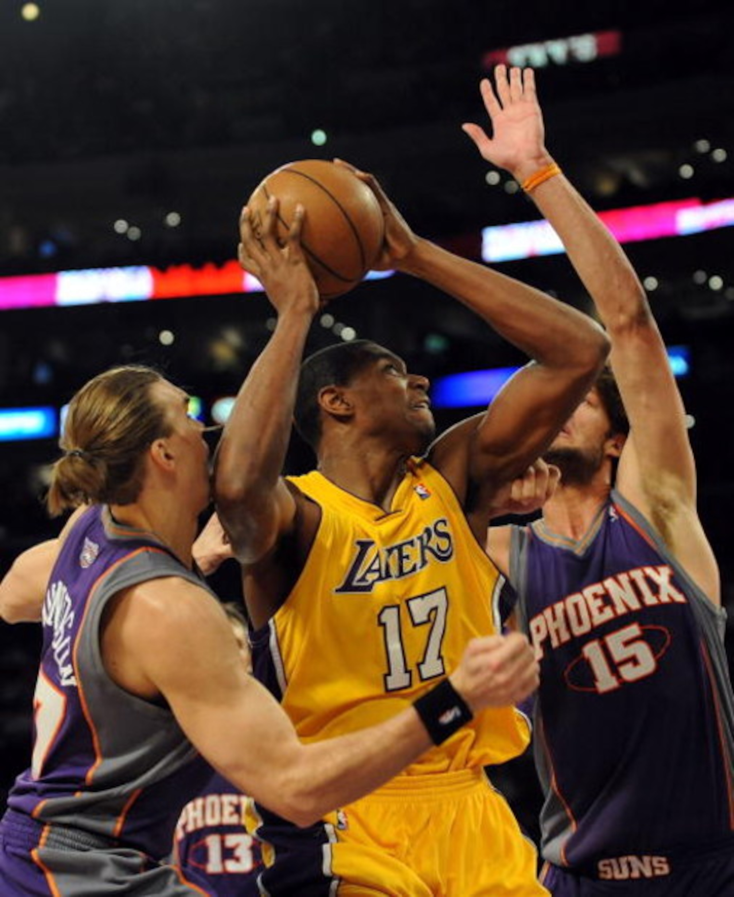 LOS ANGELES, CA - DECEMBER 10: Andrew Bynum #17 of the Los Angeles Lakers attempts a shot between Louis Amundson #17 and Robin Lopez #15 of the Phoenix Suns during the first half at the Staples Center on December, 10 2008 in Los Angeles, California. NO LOS ANGELES, CA - DECEMBER 10: Andrew Bynum #17 of the Los Angeles Lakers attempts a shot between Louis Amundson #17 and Robin Lopez #15 of the Phoenix Suns during the first half at the Staples Center on December, 10 2008 in Los Angeles, California. NO