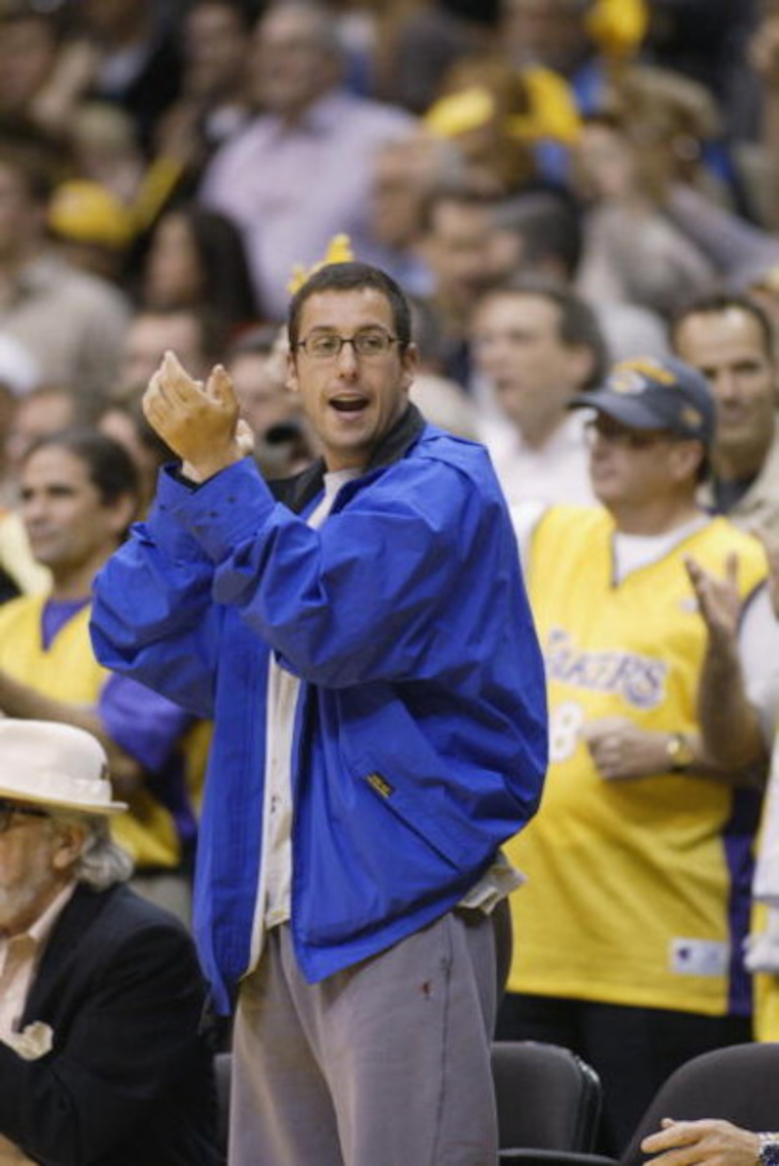 LOS ANGELES - MAY 24: Actor Adam Sandler cheers during Game three of the Western Conference Finals during the 2002 NBA Playoffs beteween the Sacramento Kings and the Los Angeles Lakers at Staples Center in Los Angeles, California on May 24, 2002. The Ki LOS ANGELES - MAY 24: Actor Adam Sandler cheers during Game three of the Western Conference Finals during the 2002 NBA Playoffs beteween the Sacramento Kings and the Los Angeles Lakers at Staples Center in Los Angeles, California on May 24, 2002. The Ki