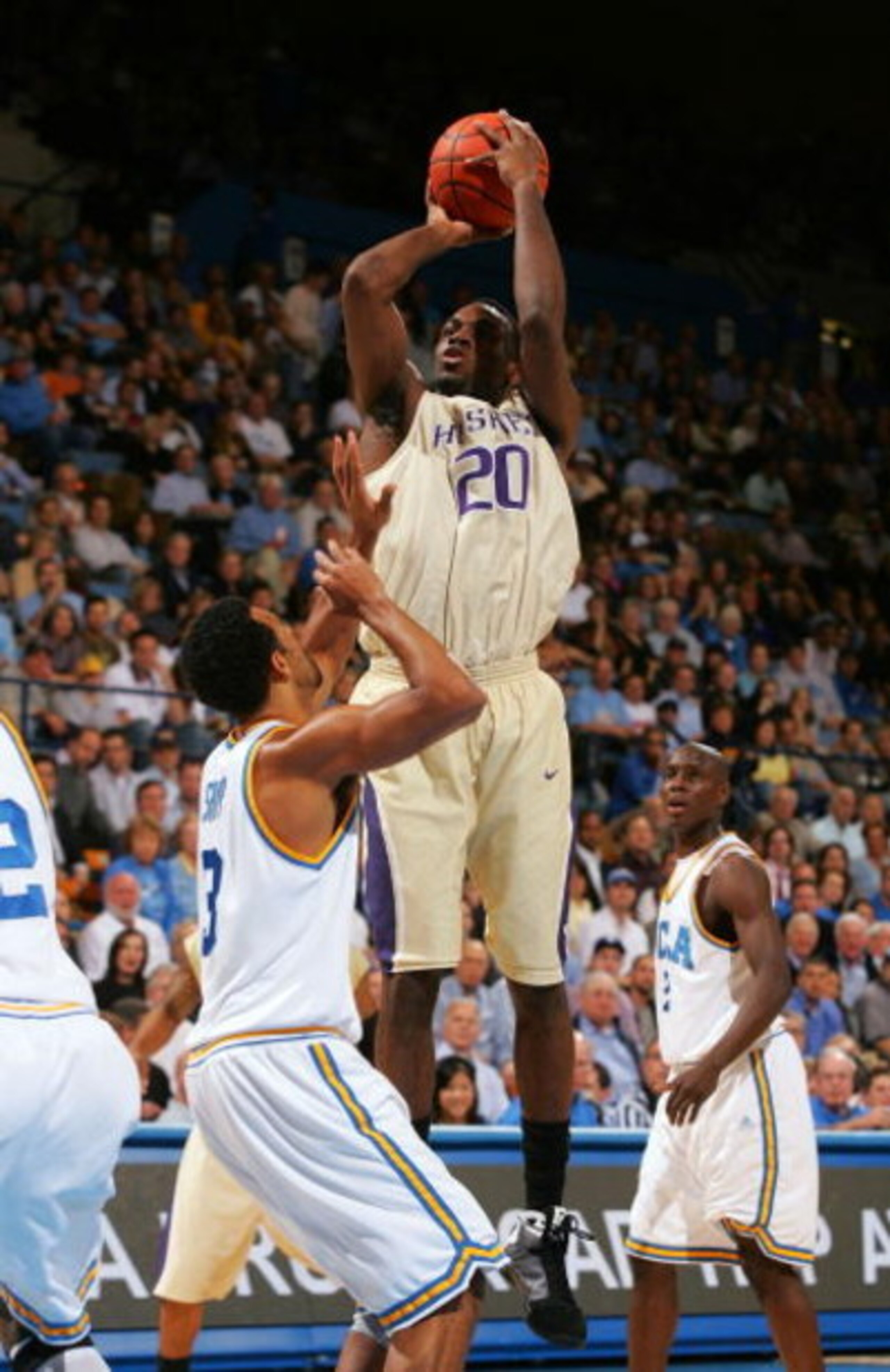 WESTWOOD, CA - FEBRUARY 19:  Quincy Pondexter #20 of the Washington Huskies goes up for the jump shot against Josh Shipp #3 of the UCLA Bruins in the first half during their NCAA basketball game at Pauley Pavilion February 19, 2009 in Westwood, California
