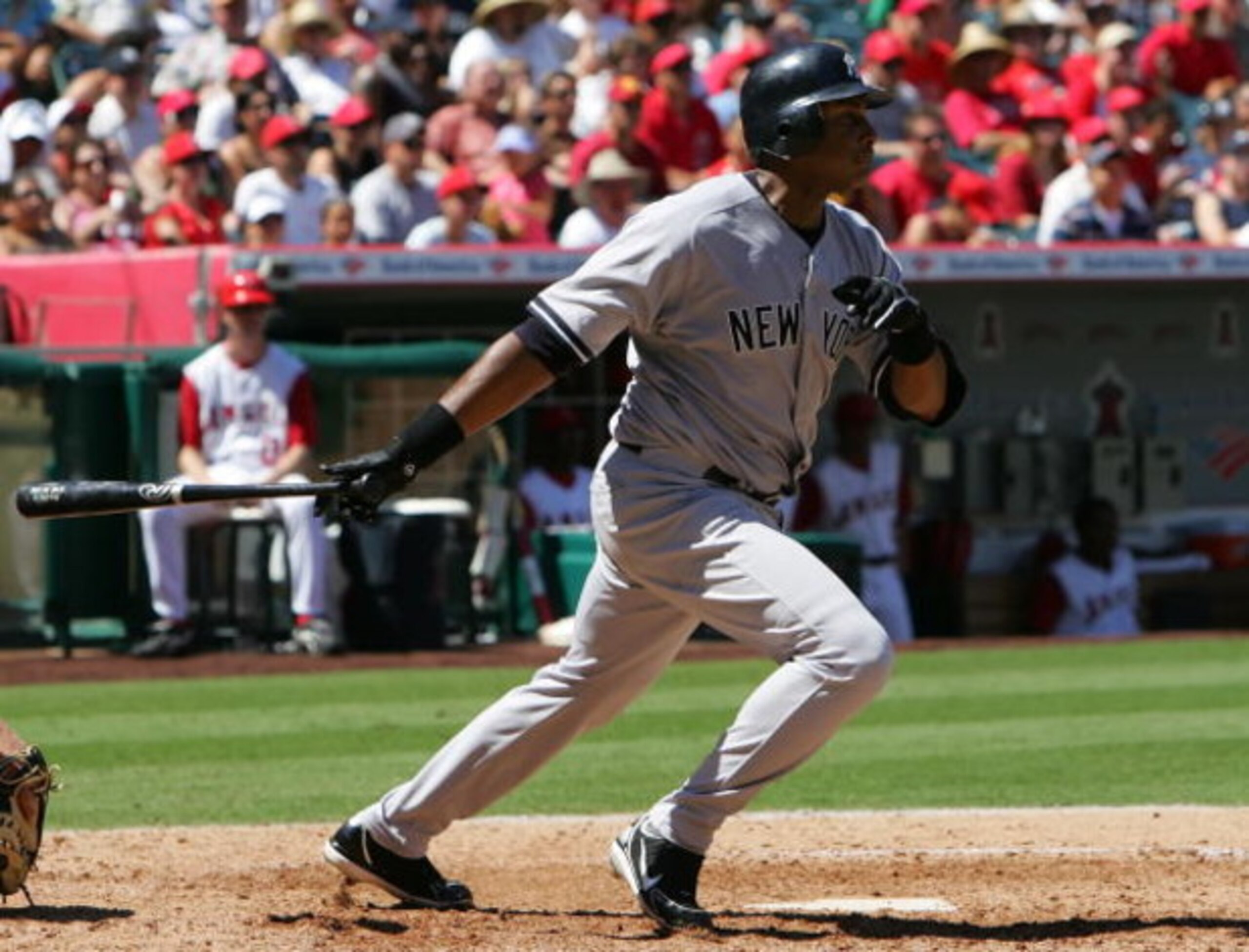 ANAHEIM, CA - AUGUST 27: Bernie Williams #51 of the New York Yankees swings at the putch during the game against the Los Angeles Angels of Anaheim at Angel Stadium in Anaheim, California.  The Yankees won 11-8.  (Photo by Lisa Blumenfeld/Getty Images)
