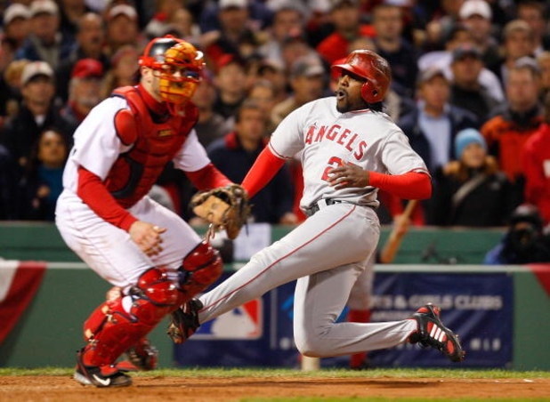 BOSTON - OCTOBER 6: Vladimir Guerrero #27 of the Los Angeles Angels of Anaheim scores the tying run in the 8th inning against the Boston Red Sox during game four of the American League Division Series at Fenway Park on October 6, 2008 in Boston, Massachus