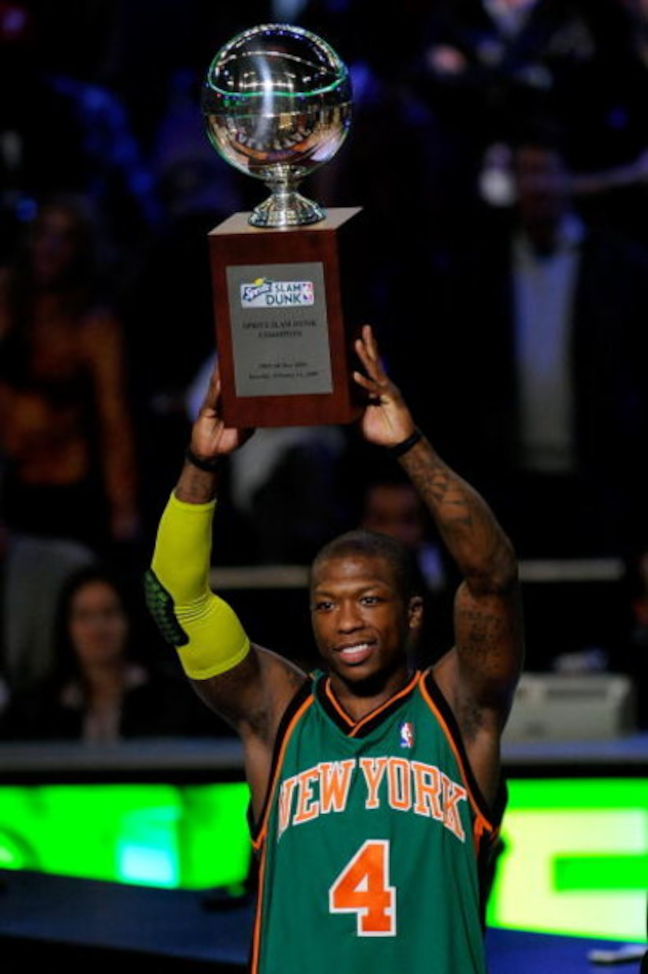 PHOENIX - FEBRUARY 14:  Nate Robinson of the New York Knicks holds up the trophy after winning the Sprite Slam Dunk Contest on All-Star Saturday Night, part of 2009 NBA All-Star Weekend at US Airways Center on February 14, 2009 in Phoenix, Arizona.  NOTE 