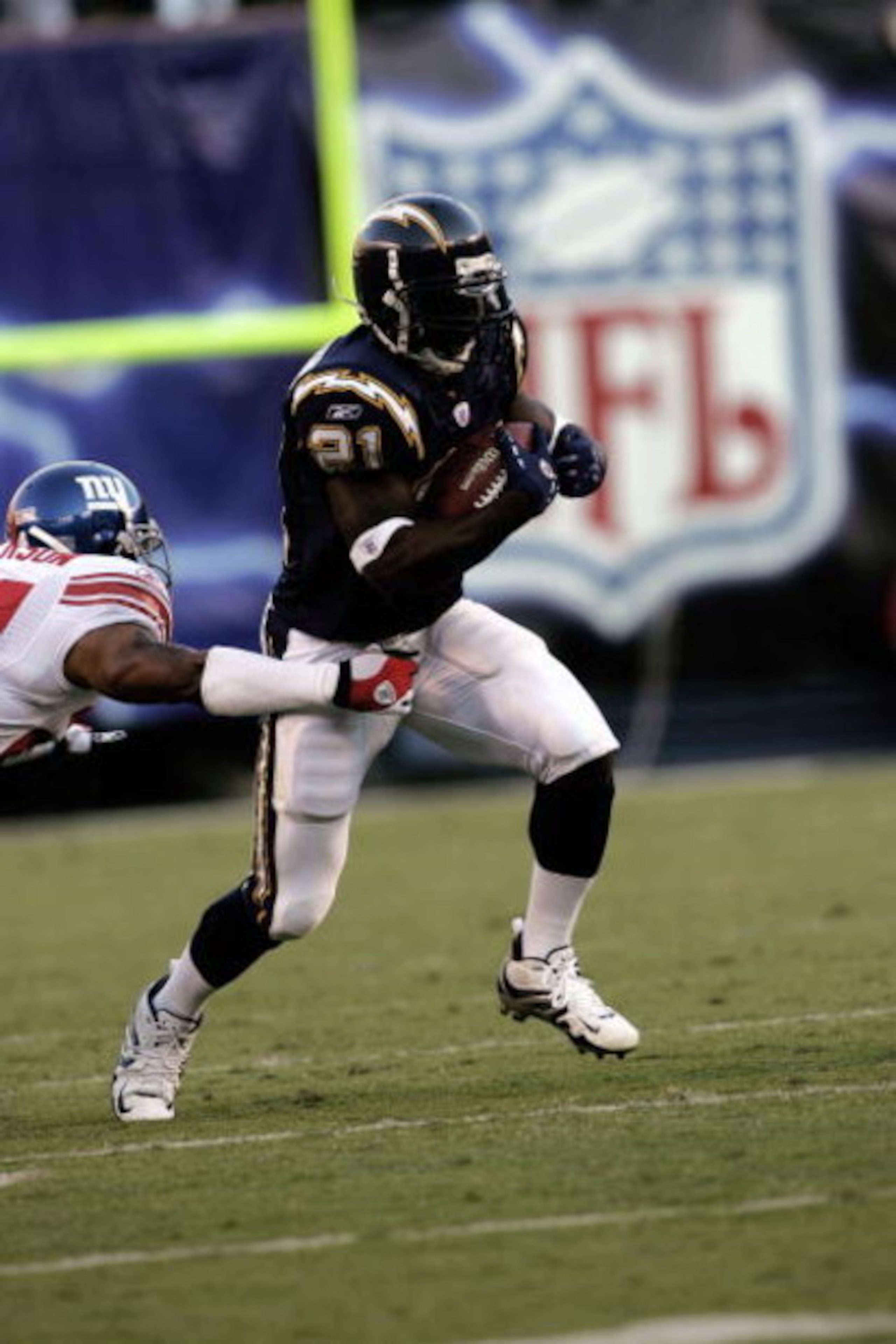 SAN DIEGO - SEPTEMBER 25:  LaDainian Tomlinson #21 of the San Diego Chargers carries the ball against the New York Giants on September 25, 2005 at Qualcomm Stadium in San Diego, California.  The Chargers won 45-23.  (Photo by Stephen Dunn /Getty Images)