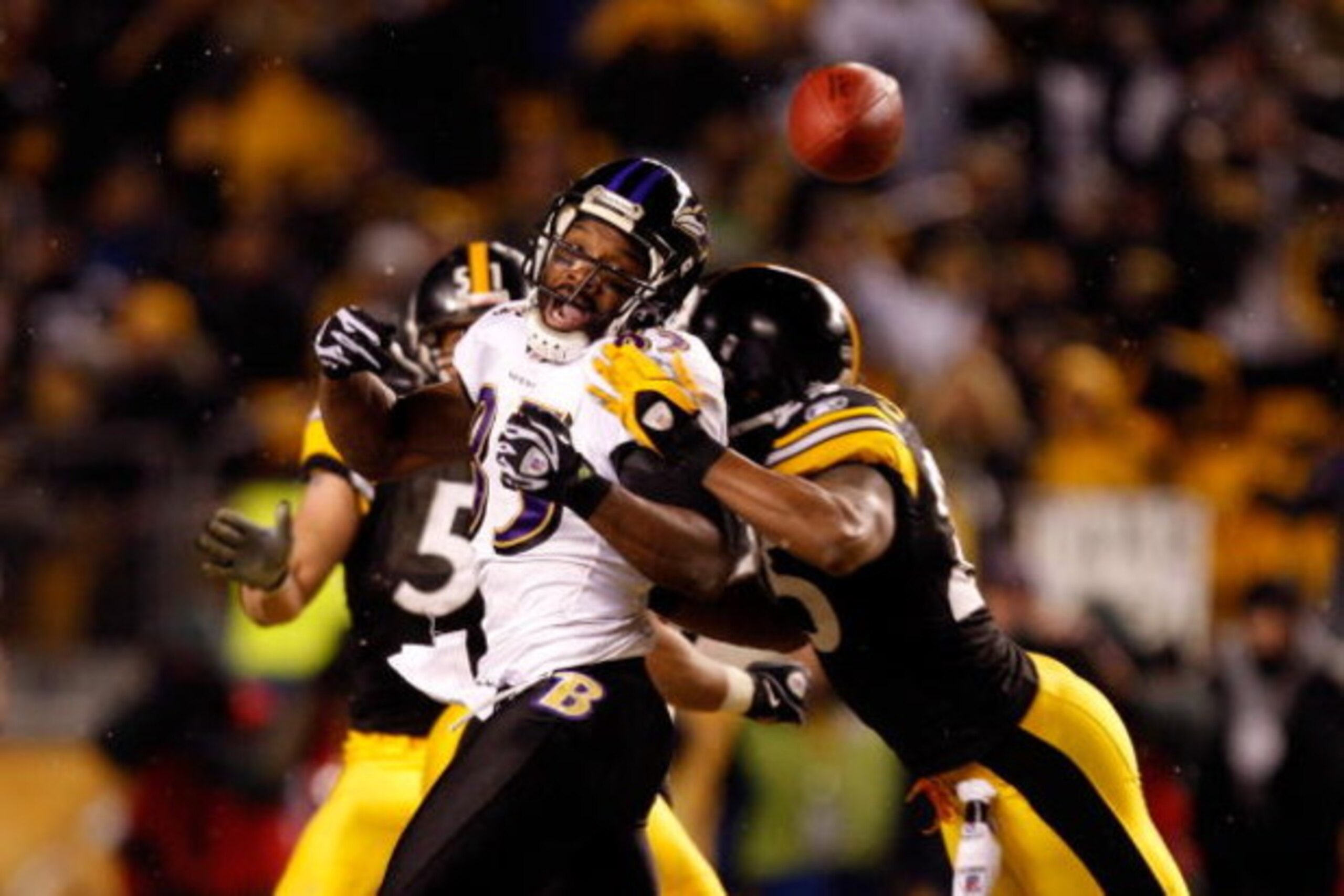 PITTSBURGH - JANUARY 18:  Derrick Mason #85 of the Baltimore Ravens can't make a catch as he is hit by Ryan Clark #25 of the Pittsburgh Steelers during the AFC Championship game on January 18, 2009 at Heinz Field in Pittsburgh, Pennsylvania.  (Photo by St