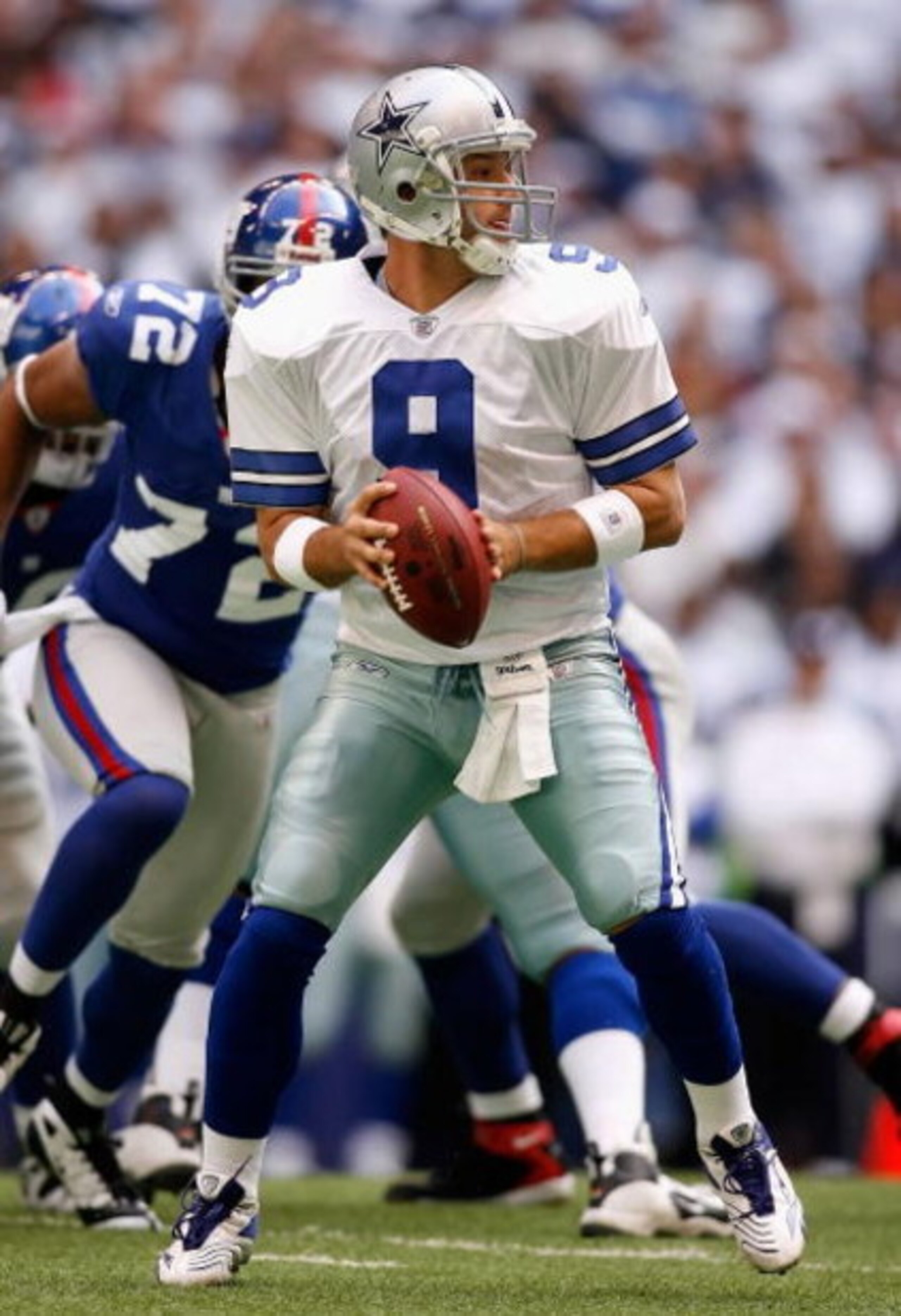 IRVING, TX - JANUARY 13:  Quarterback Tony Romo #9 of the Dallas Cowboys looks to pass during the NFC Divisional Playoff game against the New York Giants at Texas Stadium on January 13, 2008 in Irving, Texas.  The Giants defeated the Cowboys 21-17.  (Phot