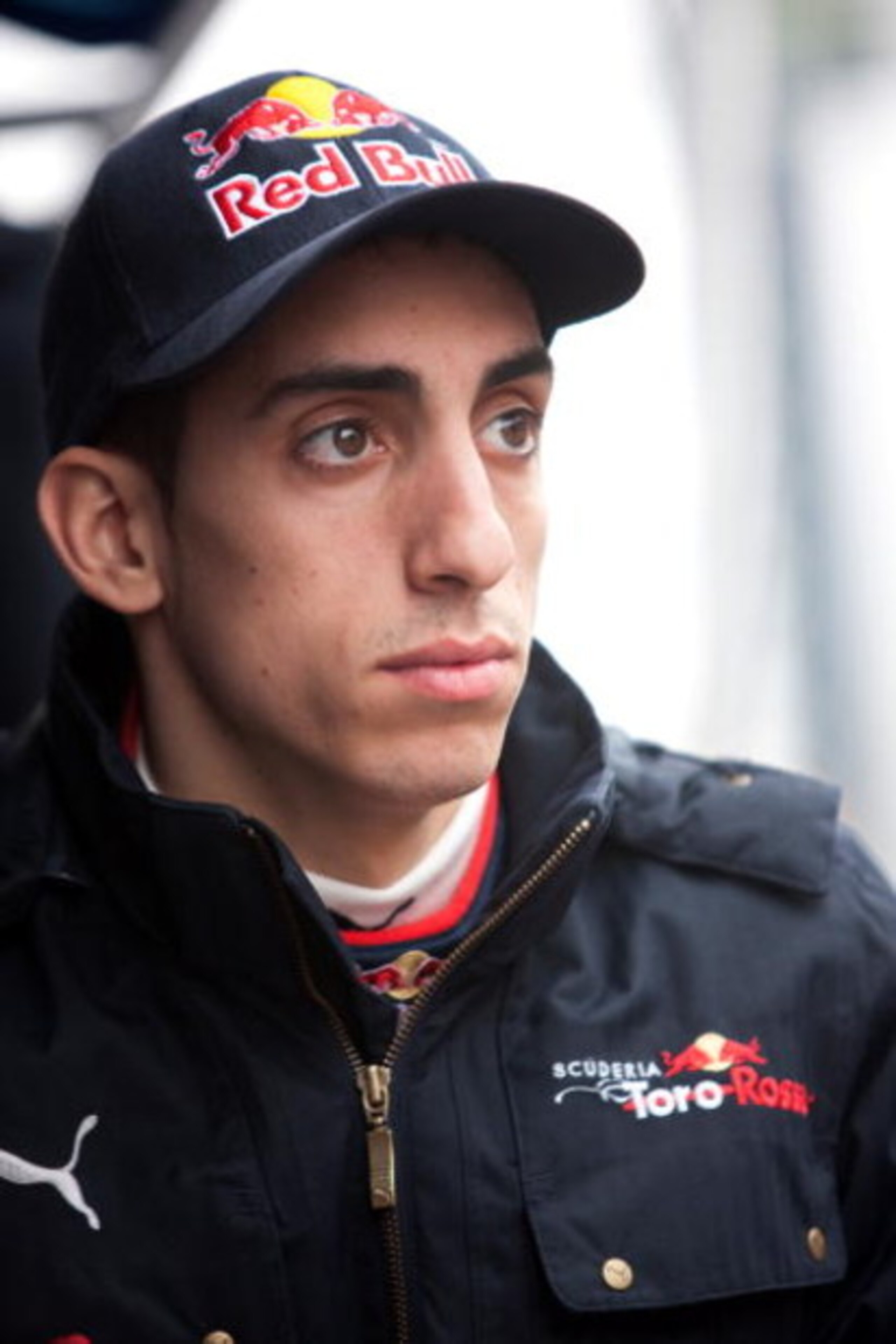 BARCELONA, SPAIN - MARCH 09:  Sebastien Buemi of Switzerland and team Toro Rosso looks on in the pit lane during formula one testing at the Circuit de Catalunya on March 9, 2009 in Barcelona, Spain.  (Photo by Peter Fox/Getty Images)