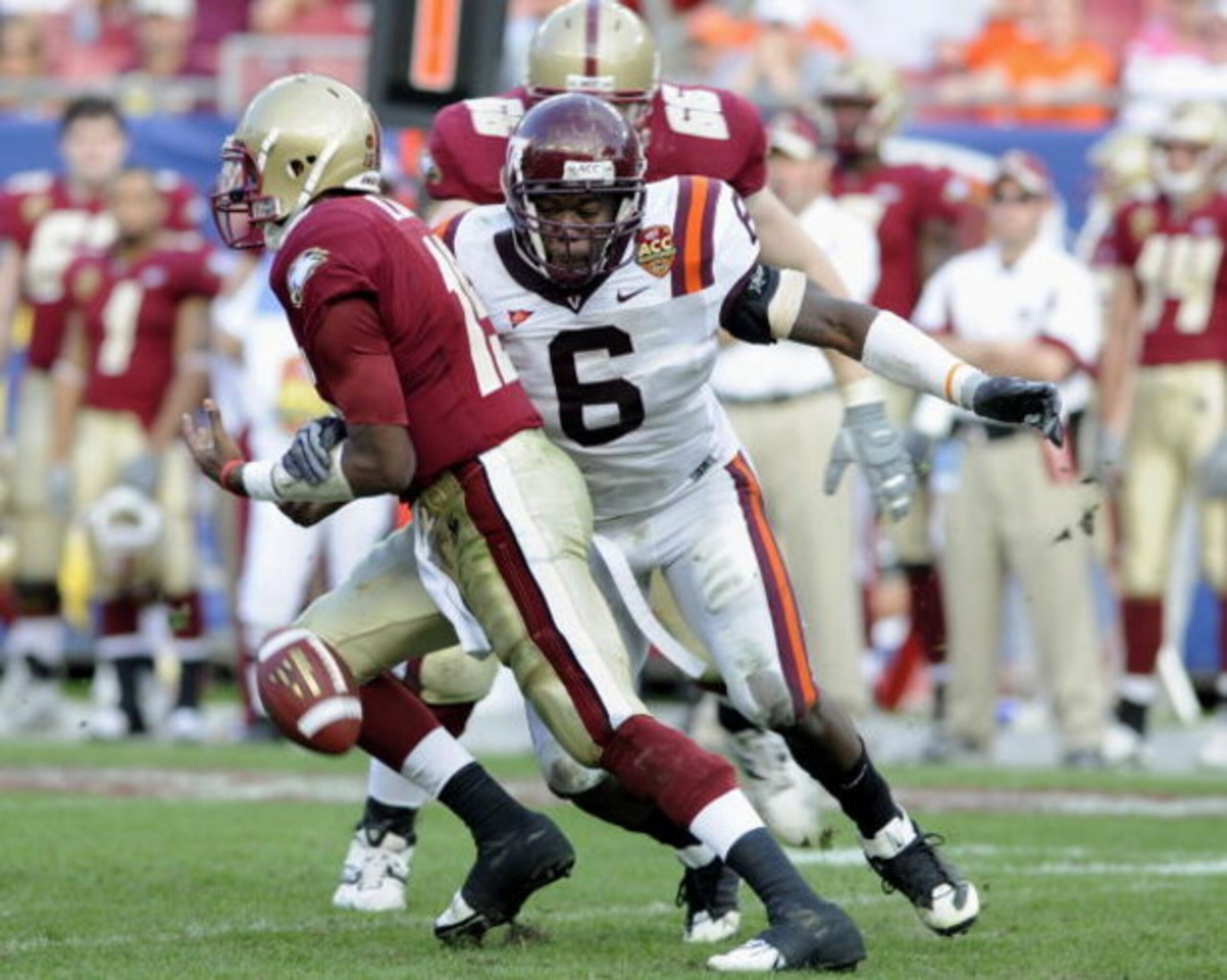TAMPA, FL - DECEMBER 6: Defensive end Jason Worilds #6 of the Virginia Tech Hokies forces a fumble by quarterback Dominique Davis #15 of the Boston College Eagles in the 2008 ACC Football Championship game at Raymond James Stadium on December 6, 2008 in T