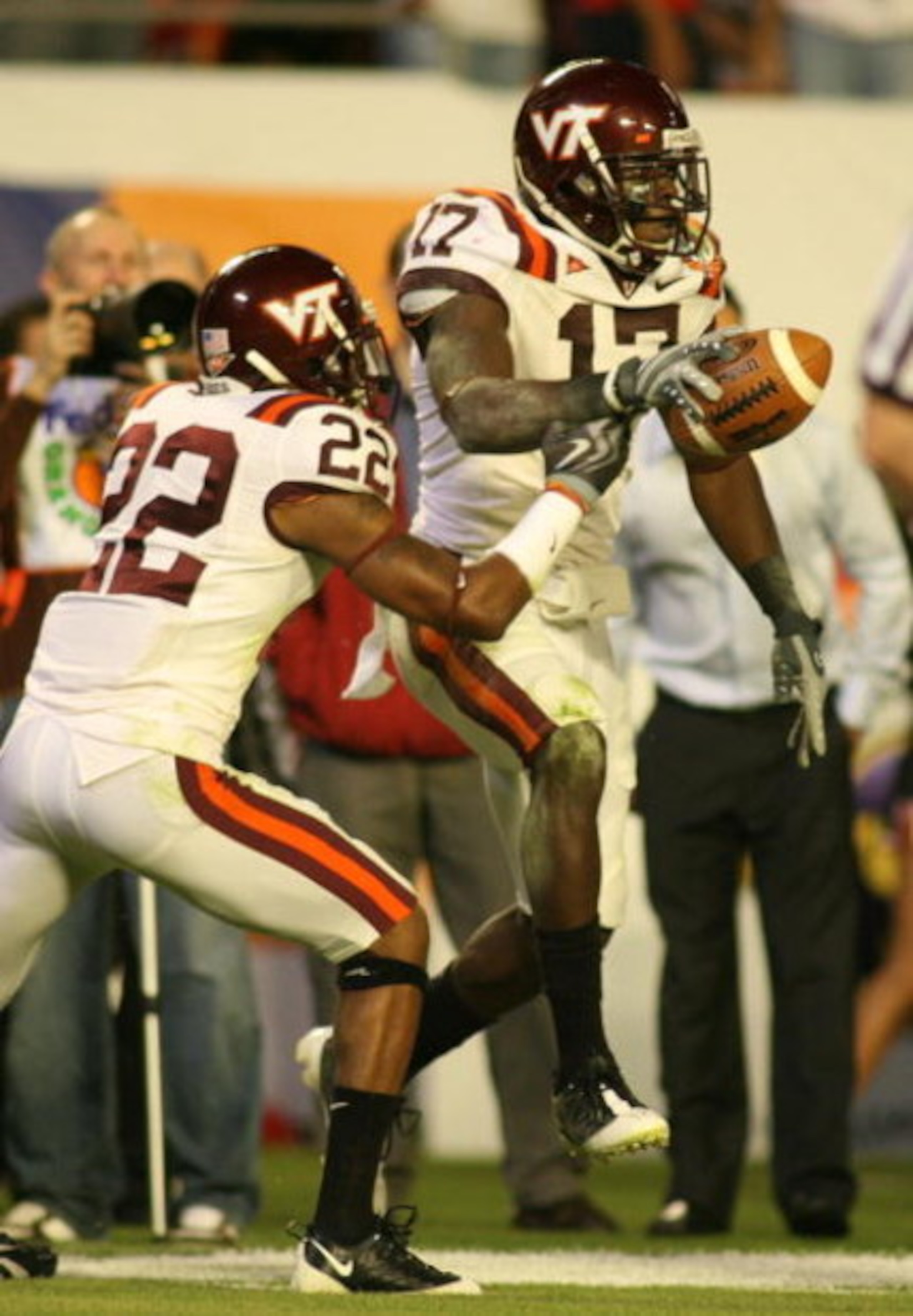 MIAMI - JANUARY 01:  Kam Chancellor #17 celabrates an interception with Stephan Virgil #22 of the Virginia Tech Hokies against  the Cincinnati Bearcats  during the FedEx Orange Bowl at Dolphin Stadium on January 1, 2009 in Miami, Florida.  (Photo by Marc 