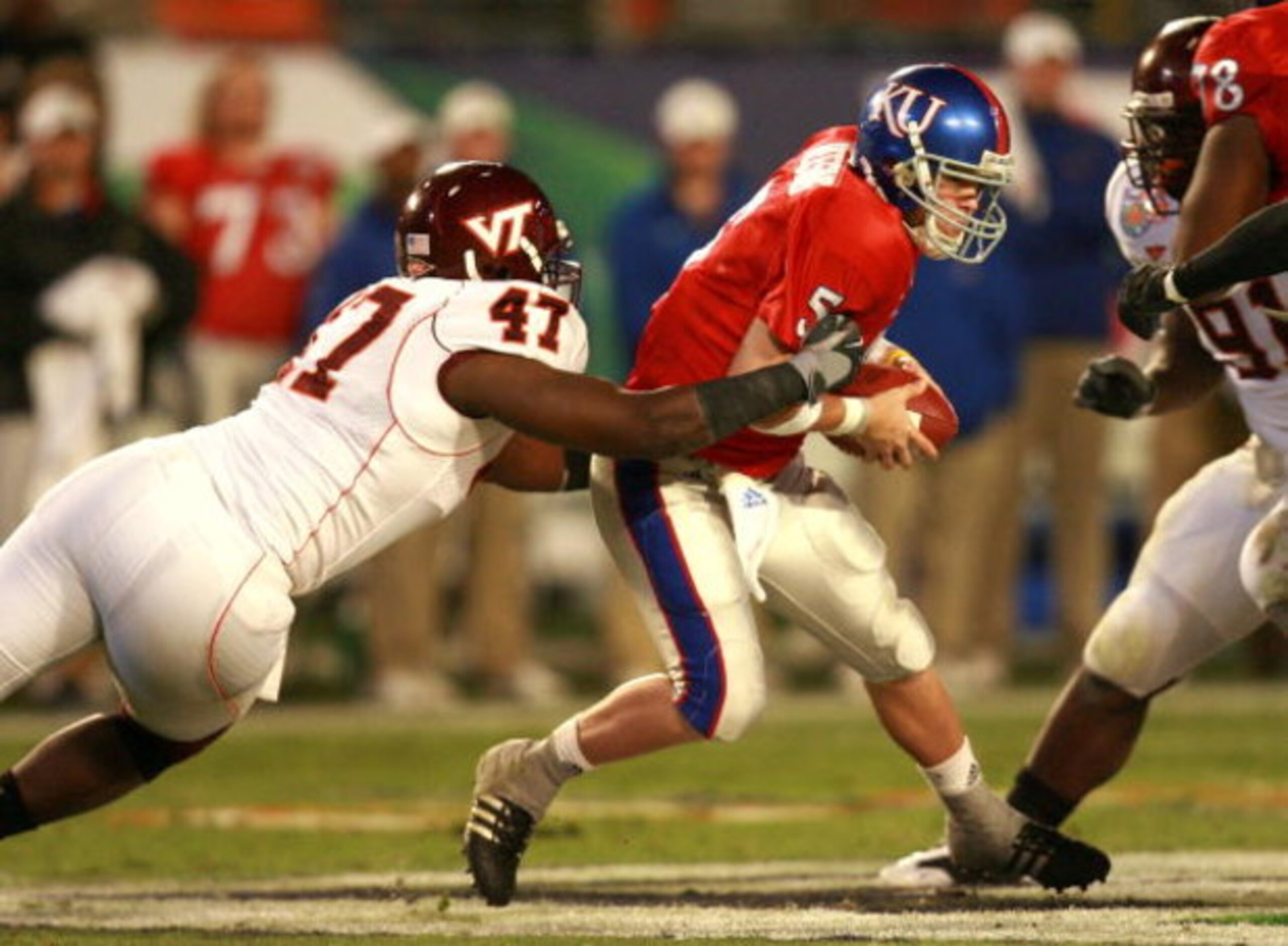 MIAMI - JANUARY 03:  Nekos Brown #47 of the Virginia Tech Hokies sacks quarterback Todd Reesing #5 of the Kansas Jayhawks in the second quarter of the FedEx Orange Bowl at Dolphin Stadium on January 3, 2008 in Miami, Florida.  (Photo by Doug Benc/Getty Im