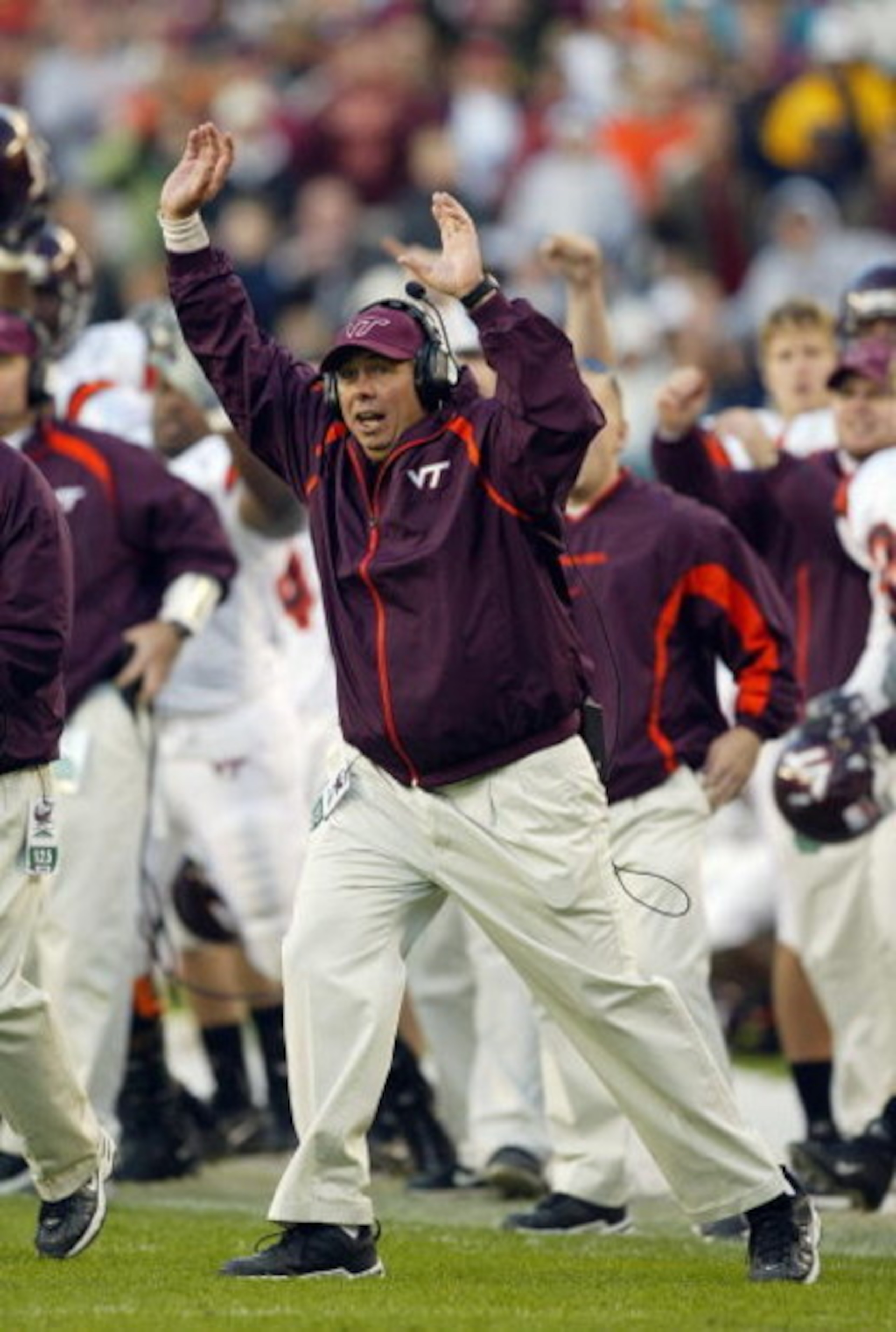PHILADELPHIA - NOVEMBER 15:  Offensive coordinater Bryan Stinespring of the Virginia Tech Hokies celebrates during the game against the Temple Owls on November 15, 2003 at Lincoln Financial Field in Philadelphia, Pennsylvania. Virginia Tech defeated Templ